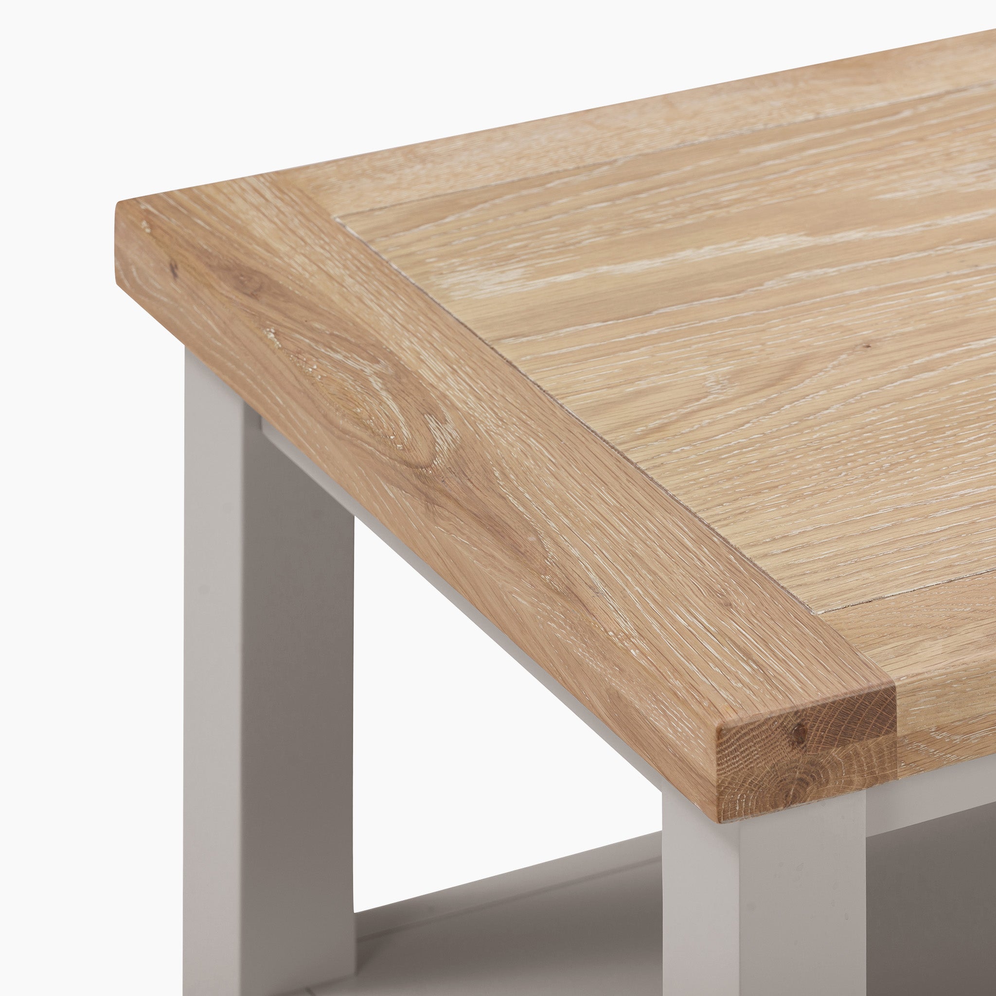 Close-up of the Burford Large Coffee Table with Shelf, showcasing its light natural oak finish and Pebble Grey legs.