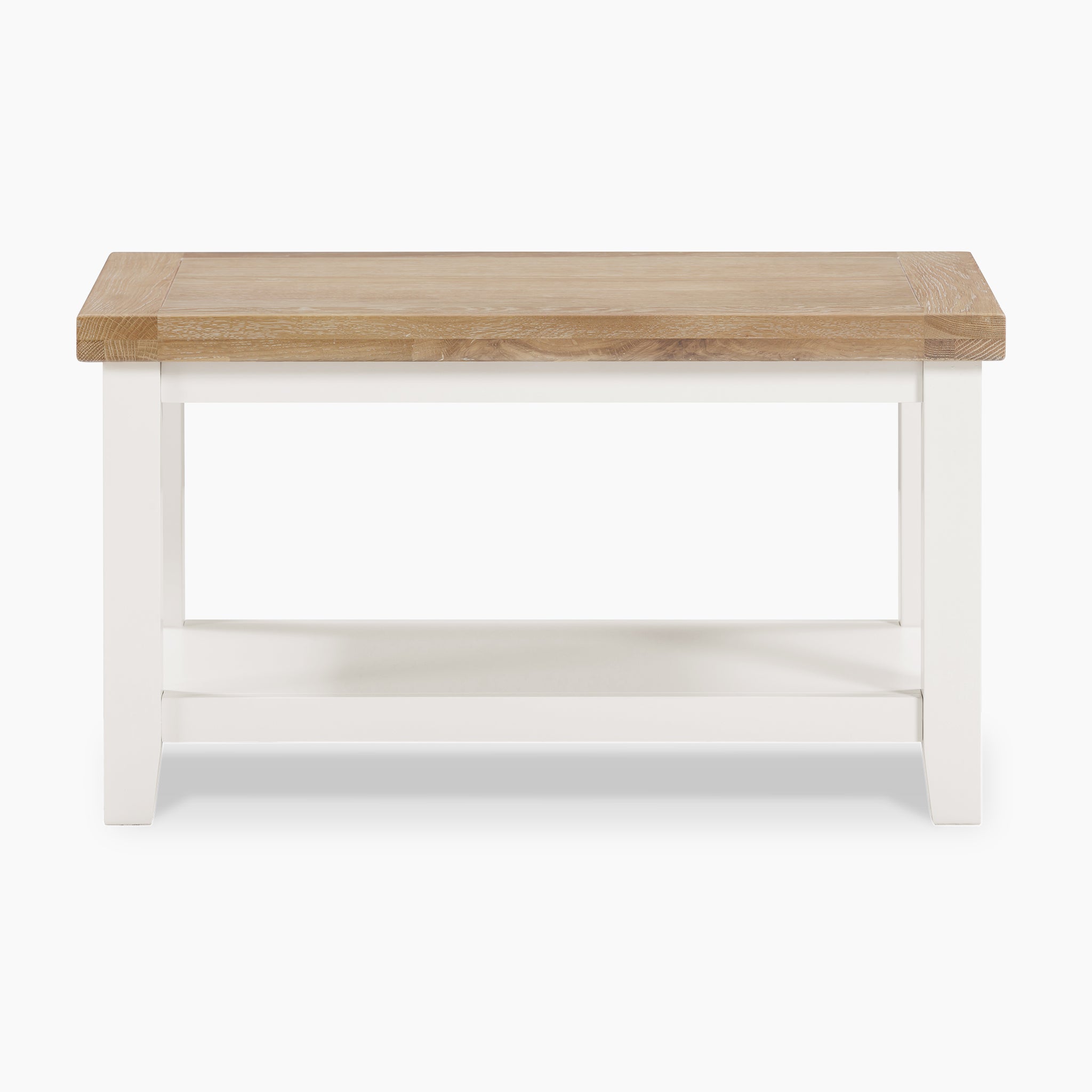 Burford Large Coffee Table with Shelf in Warm White, showcasing a natural oak top and white legs on a pristine white background.