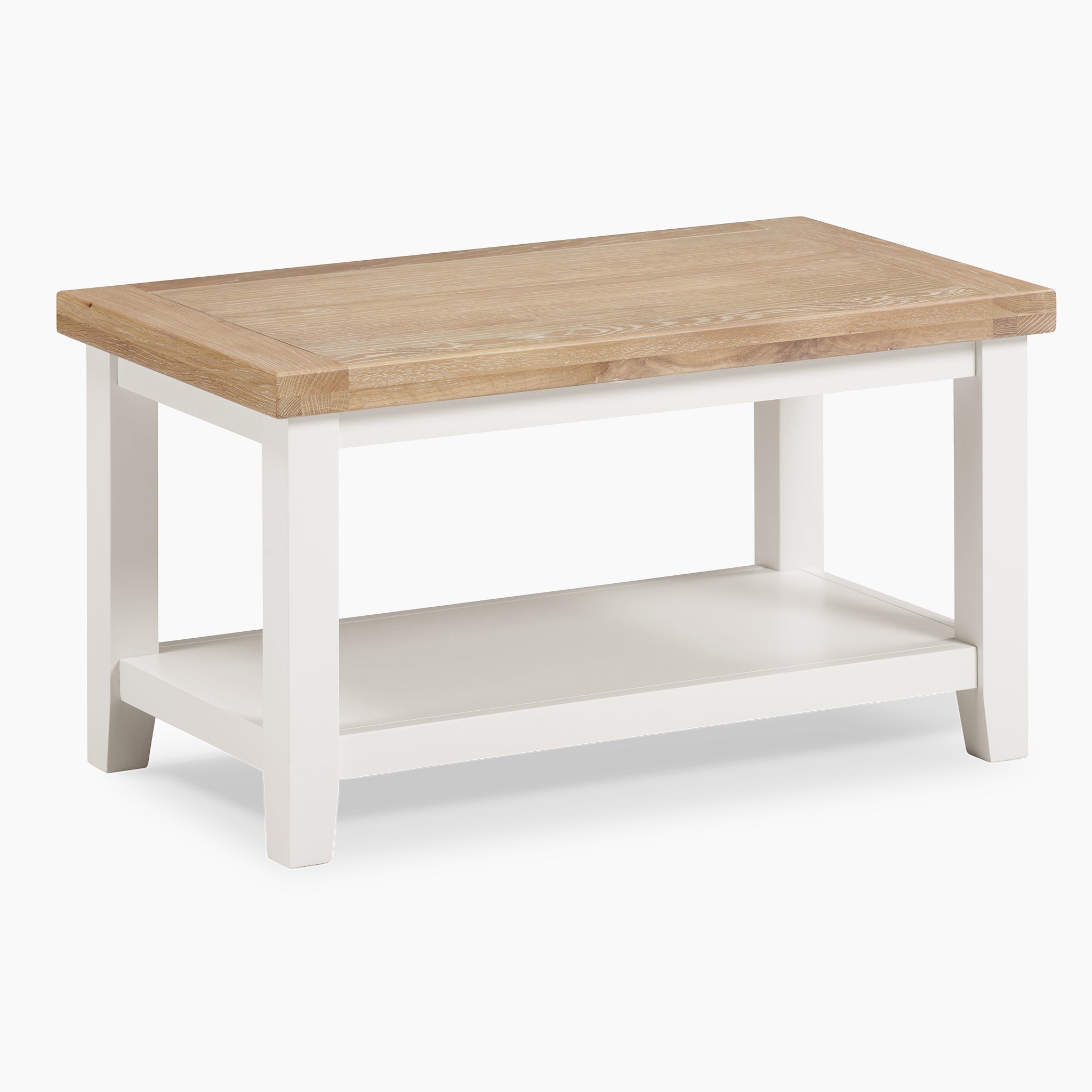 The Burford Large Coffee Table with Shelf in Warm White showcases a spacious natural oak top and white legs, enhanced by a practical lower shelf.