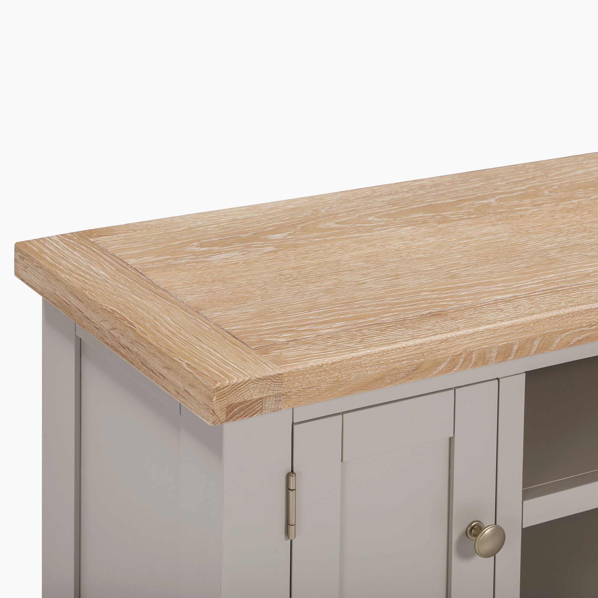 The Burford 120cm Media Unit in Pebble Grey features a natural oak top and a round metal knob.