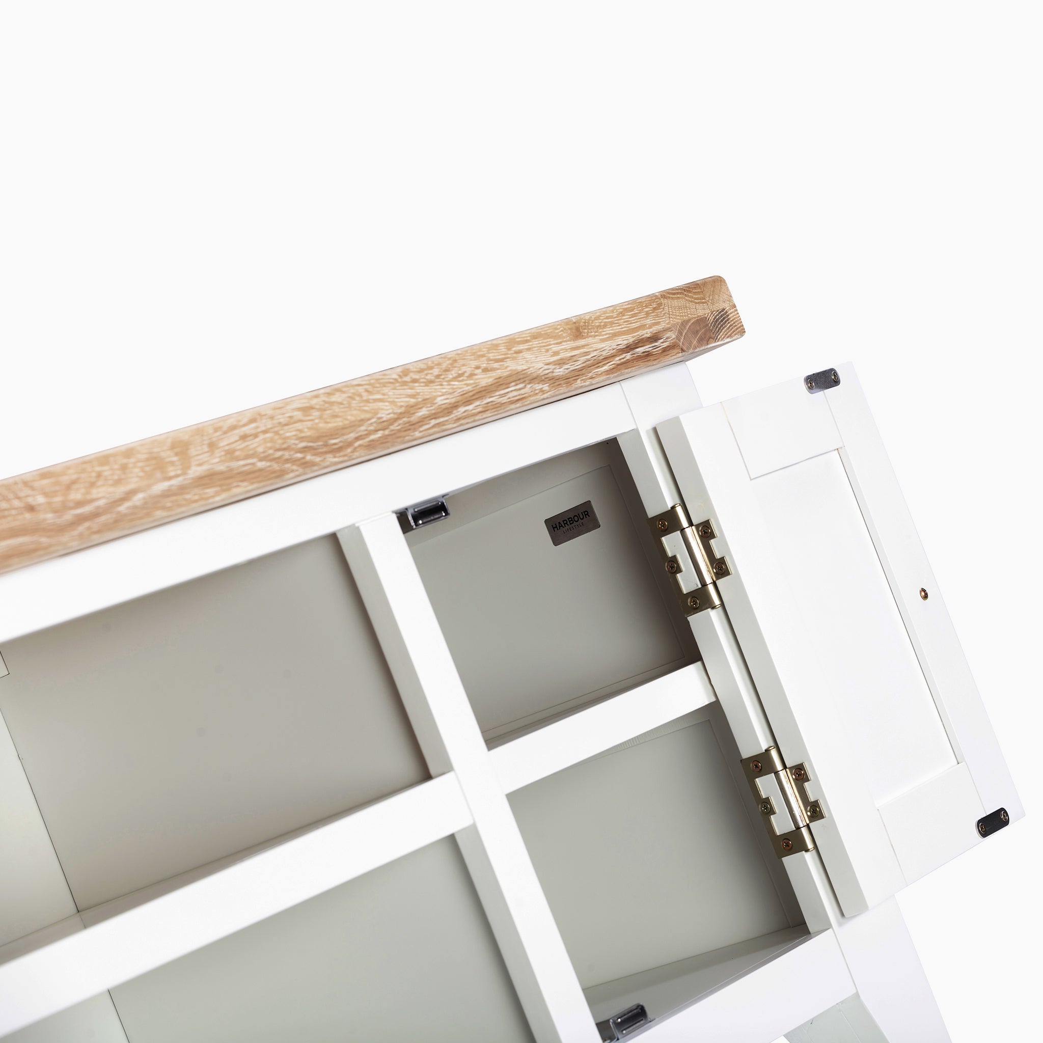 Warm white media unit featuring a white-washed oak top, partially open doors, and visible shelving, evoking the rustic charm of the Burford 120cm Media Unit.