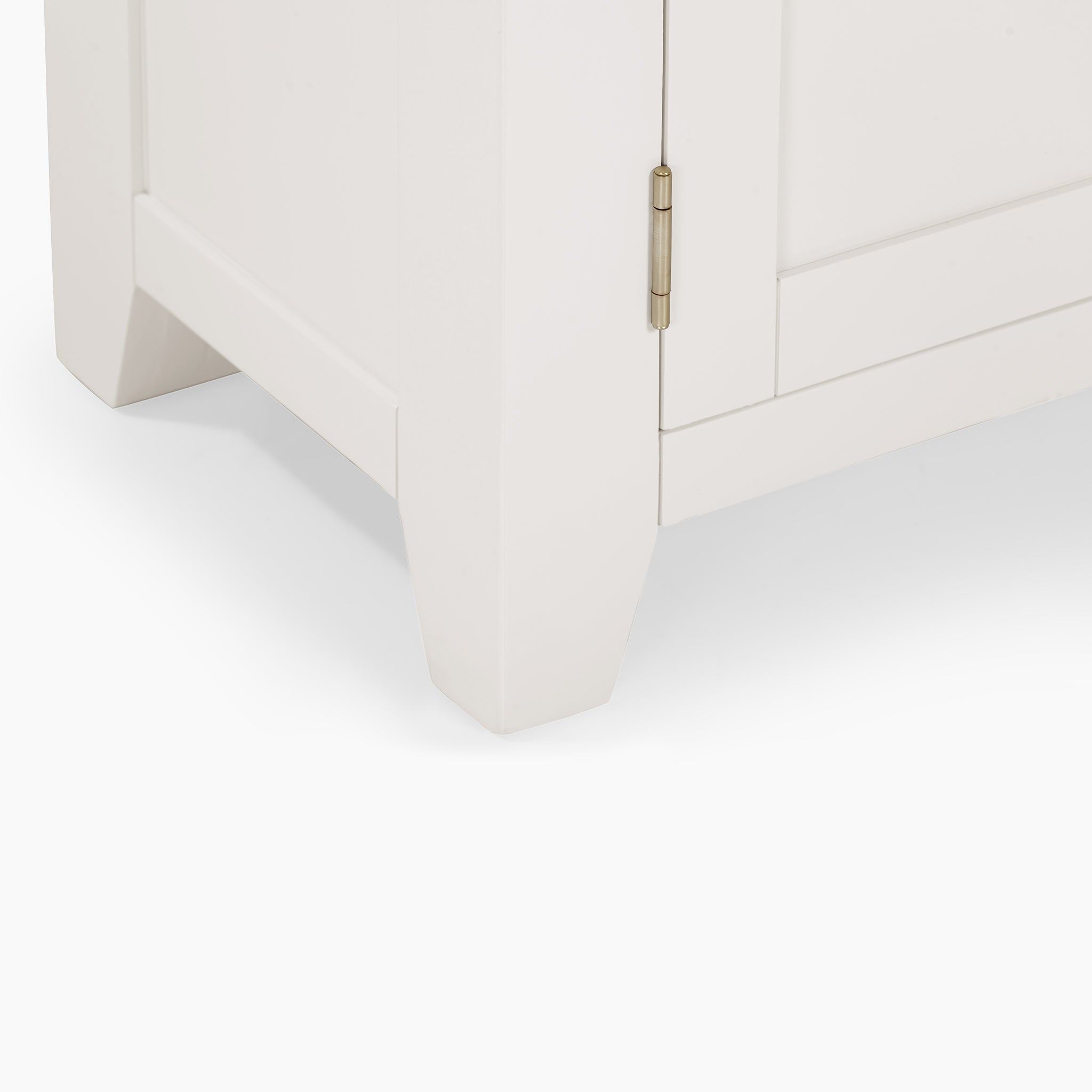 A close-up of a white cabinet corner with a visible hinge, featuring a minimalist design that perfectly complements the warm aesthetics of the Burford Large 180cm Media Unit in Warm White.