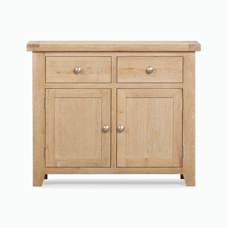 Burford 2 Door 2 Drawers Sideboard in Natural Oak, featuring two drawers and two cabinets with round metal knobs.