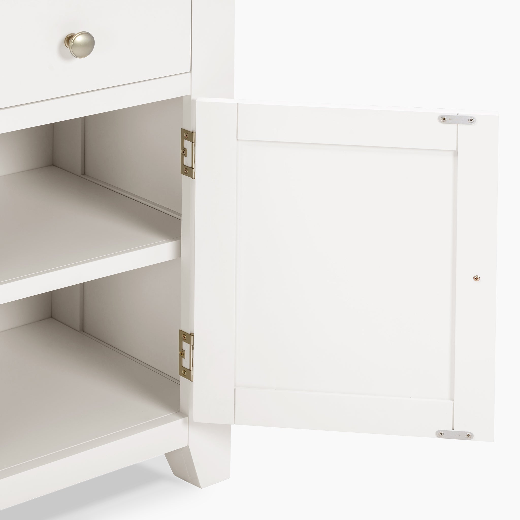 The Burford 2 Door 2 Drawers Sideboard in Warm White showcases one door ajar, revealing the two interior shelves. It features a minimalist design with a silver knob.