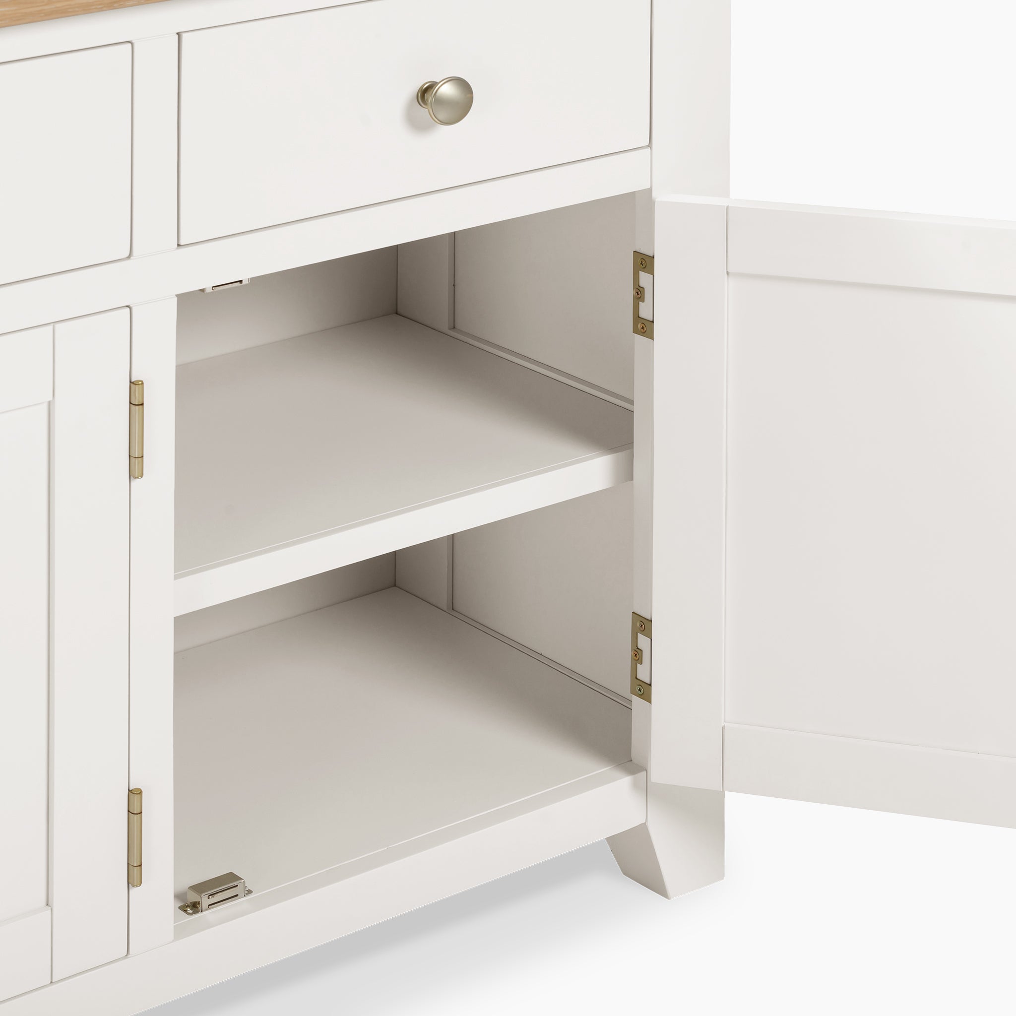 The Burford Large 3 Door 3 Drawers Sideboard in Warm White showcases a sleek design with its white cabinet. When opened, it reveals two interior shelves and three drawers above, making it a stylish storage solution that complements any space with its natural oak finish.