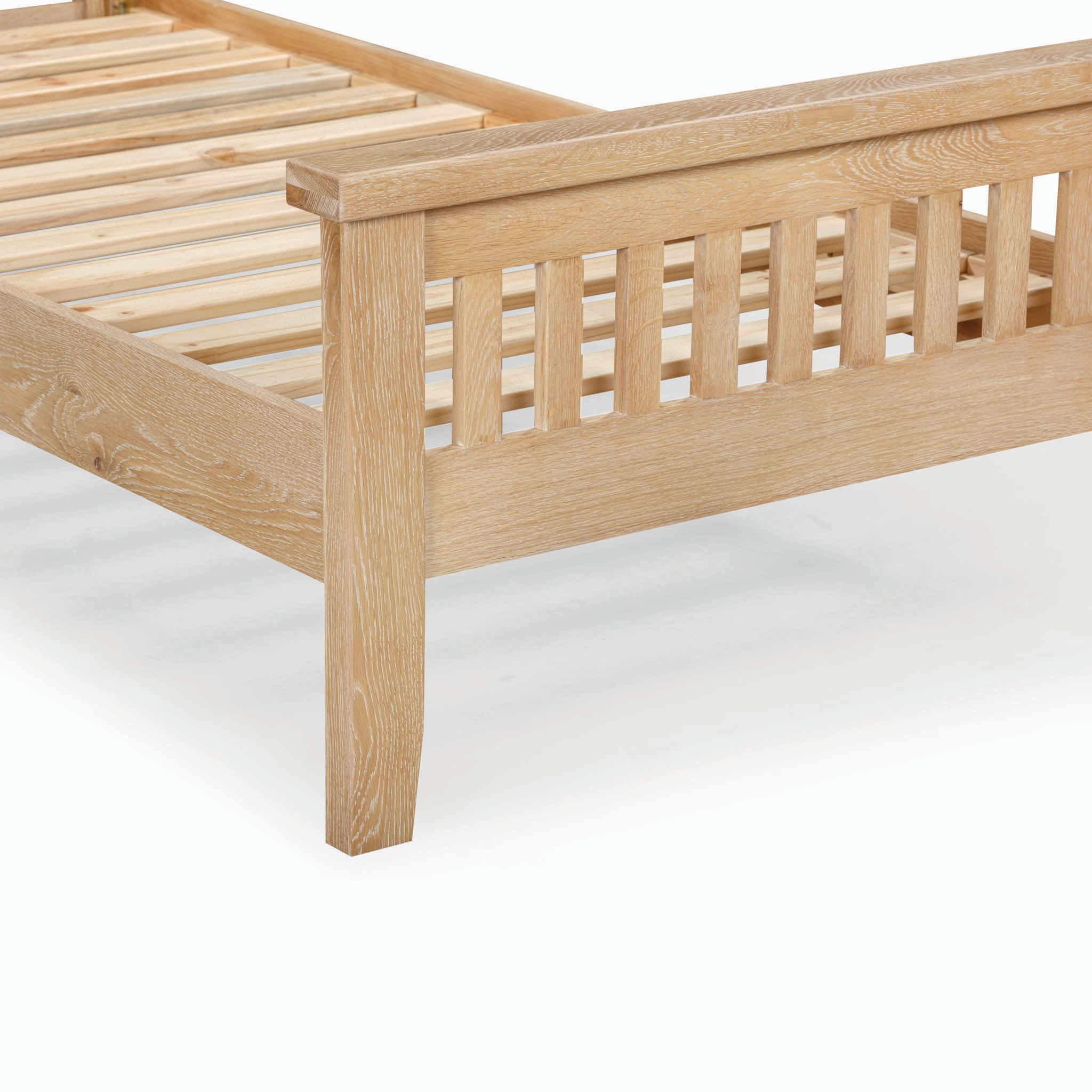 The Burford 3ft High-End Single Bed Frame in Natural Oak is a premium bed that showcases a light wooden design with a natural oak finish, complete with slatted headboard and footboard, and horizontal slats for optimal mattress support.