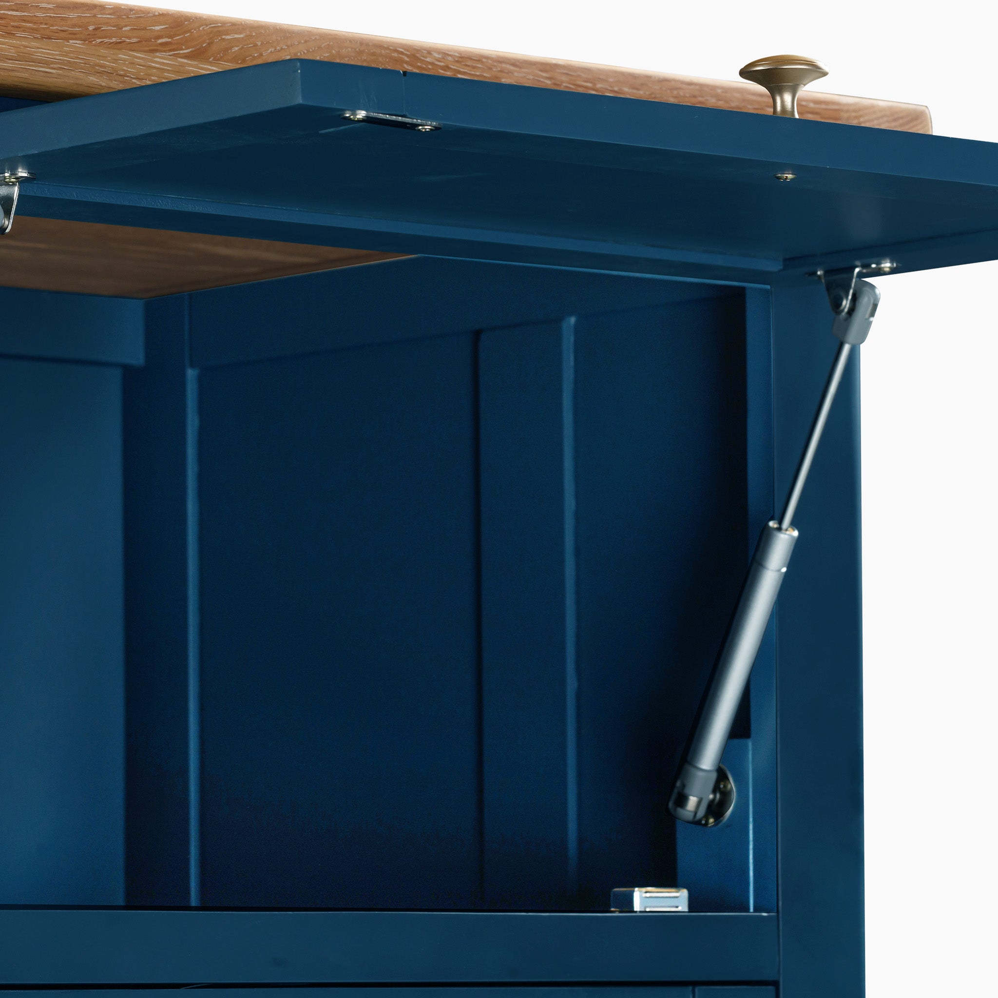 Close-up of the Burford Single Larder Unit in Navy Blue, featuring an open top lid supported by a hydraulic hinge, ideal for enhancing your kitchen storage. Its design beautifully complements the natural oak finishes in modern spaces.