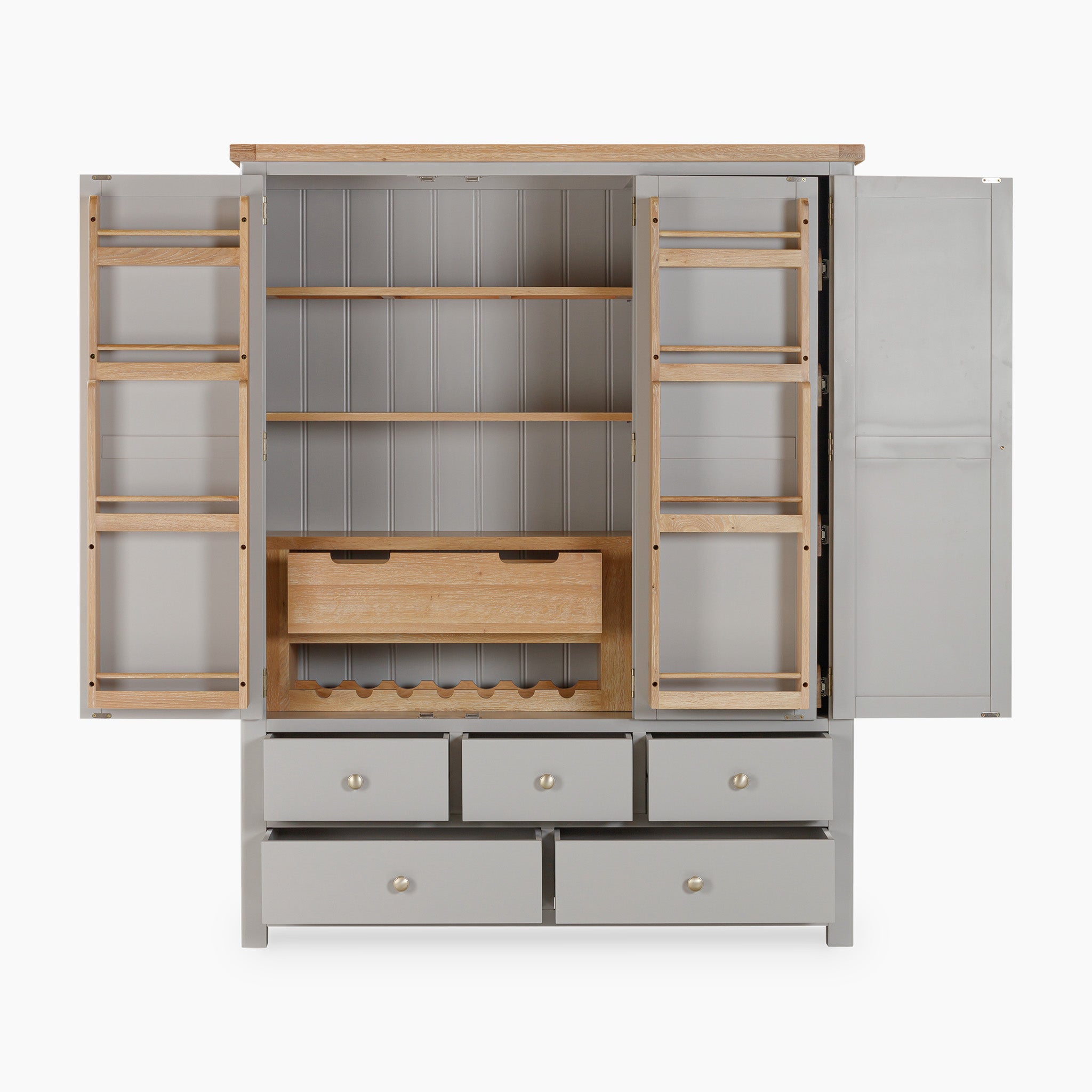 The Burford Triple Larder Unit in Pebble Grey is an open cabinet with natural oak shelves and six drawers, providing excellent kitchen storage solutions. It includes wine storage and tall side doors, making it a versatile and stylish addition to any home.