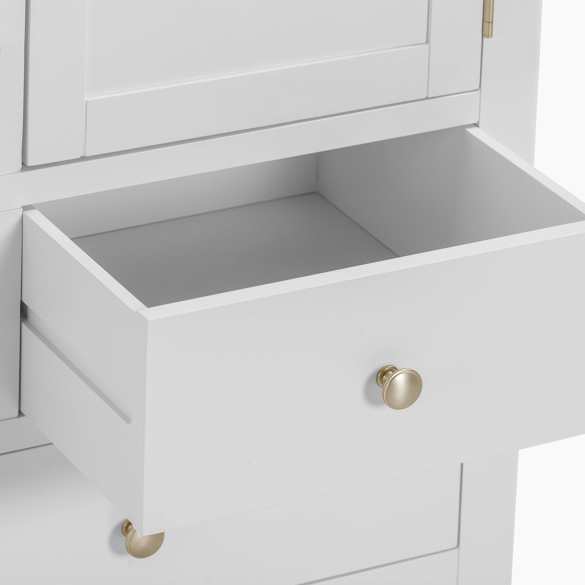 Open the white drawer with brass knobs on the Burford Triple Larder Unit in Warm White, highlighting versatile storage options perfect for any kitchen.