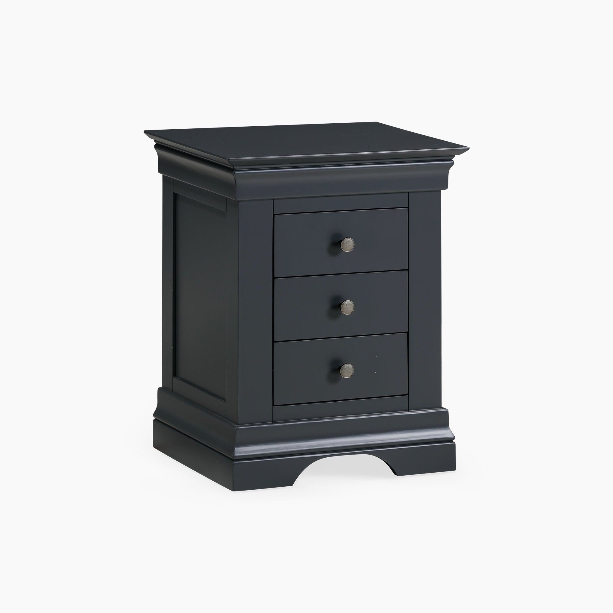 The Chalbury 3 Drawer Bedside Table in Dusky Black showcases a sleek design with three drawers and round knobs, crafted from solid oak. Its timeless elegance stands out against a white background.