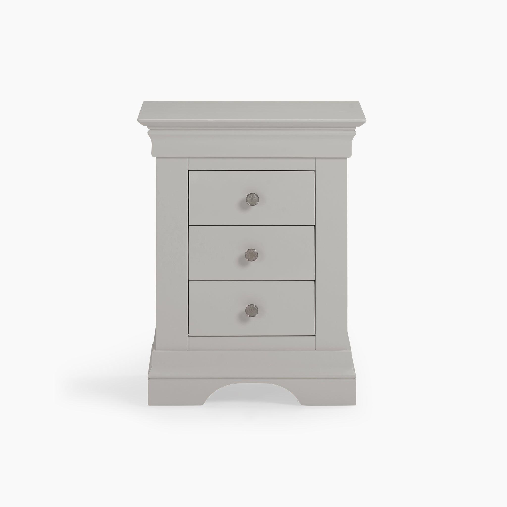 The Chalbury 3 Drawer Bedside Table in Pebble Grey showcases a classic design with round handles, elegantly contrasted against a crisp white background.