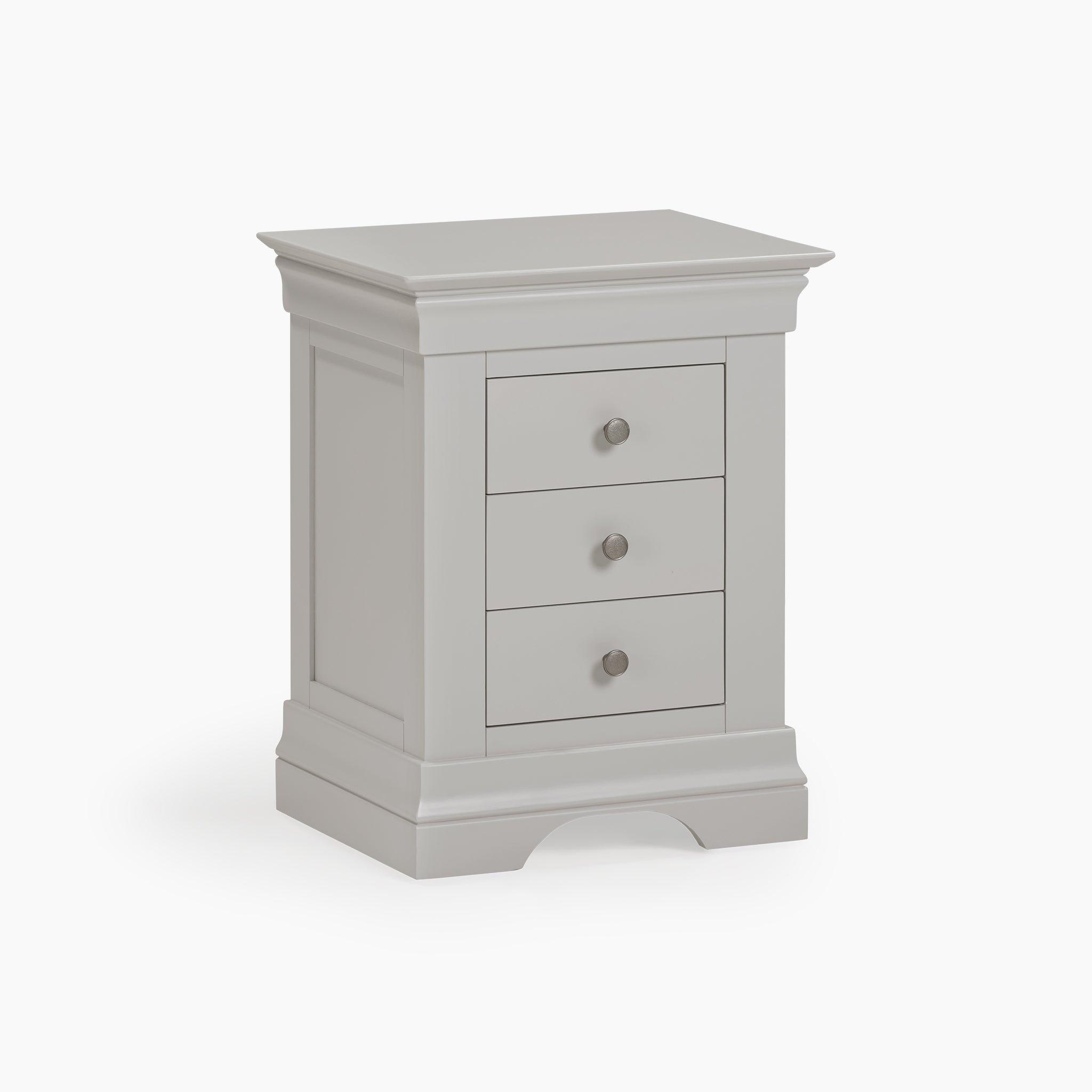 The Chalbury 3 Drawer Bedside Table in Pebble Grey showcases a stylish design with round knobs, complemented by a simple white backdrop.