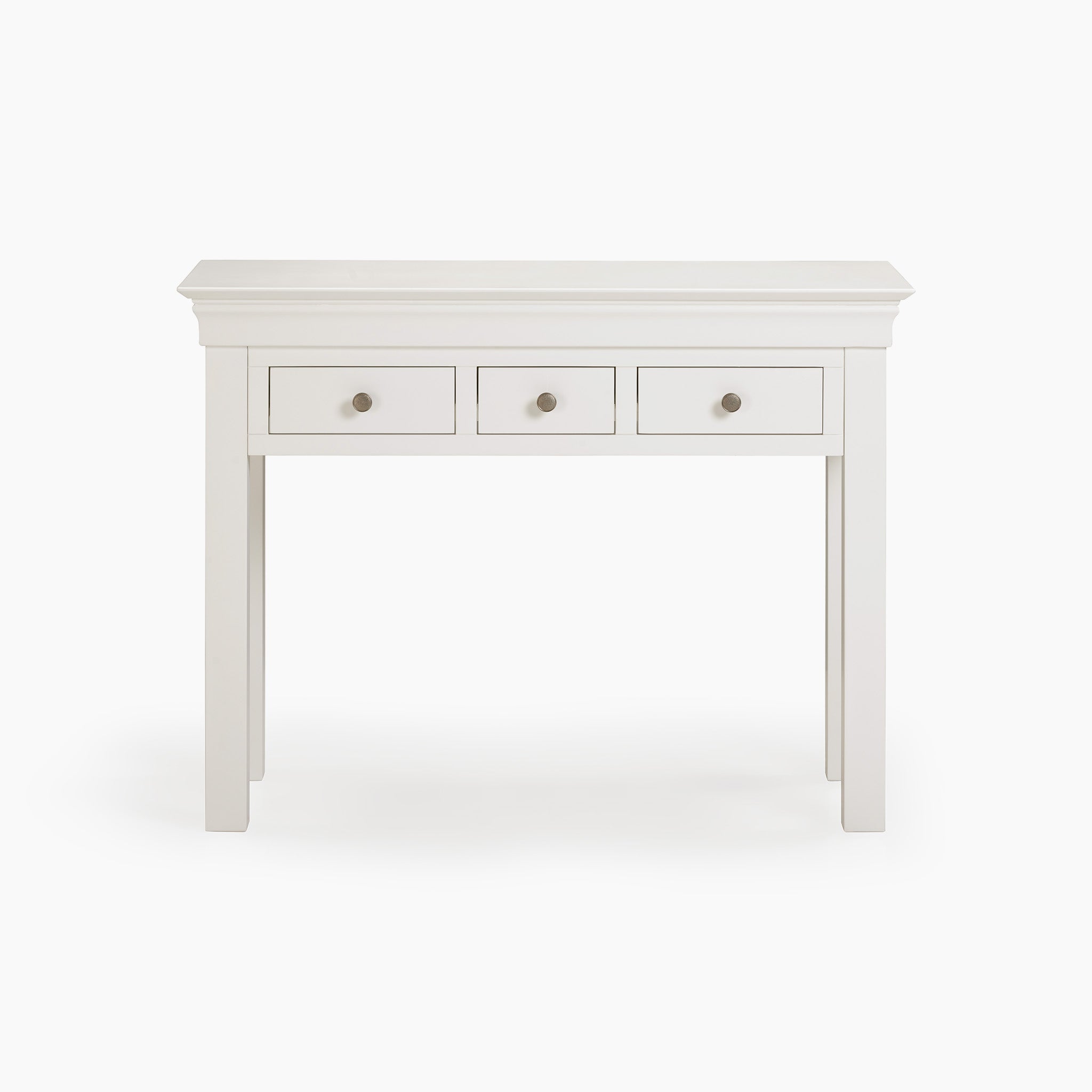 The Chalbury Console Desk in Warm White exudes modern elegance with its minimalist design, featuring three sleek drawers against a pristine backdrop, making it an ideal choice for contemporary spaces.