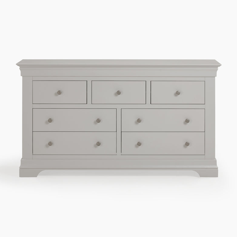 The Chalbury 3 Over 4 Chest of Drawers in Pebble Grey includes seven spacious drawers with round handles, seamlessly combining style and functionality.