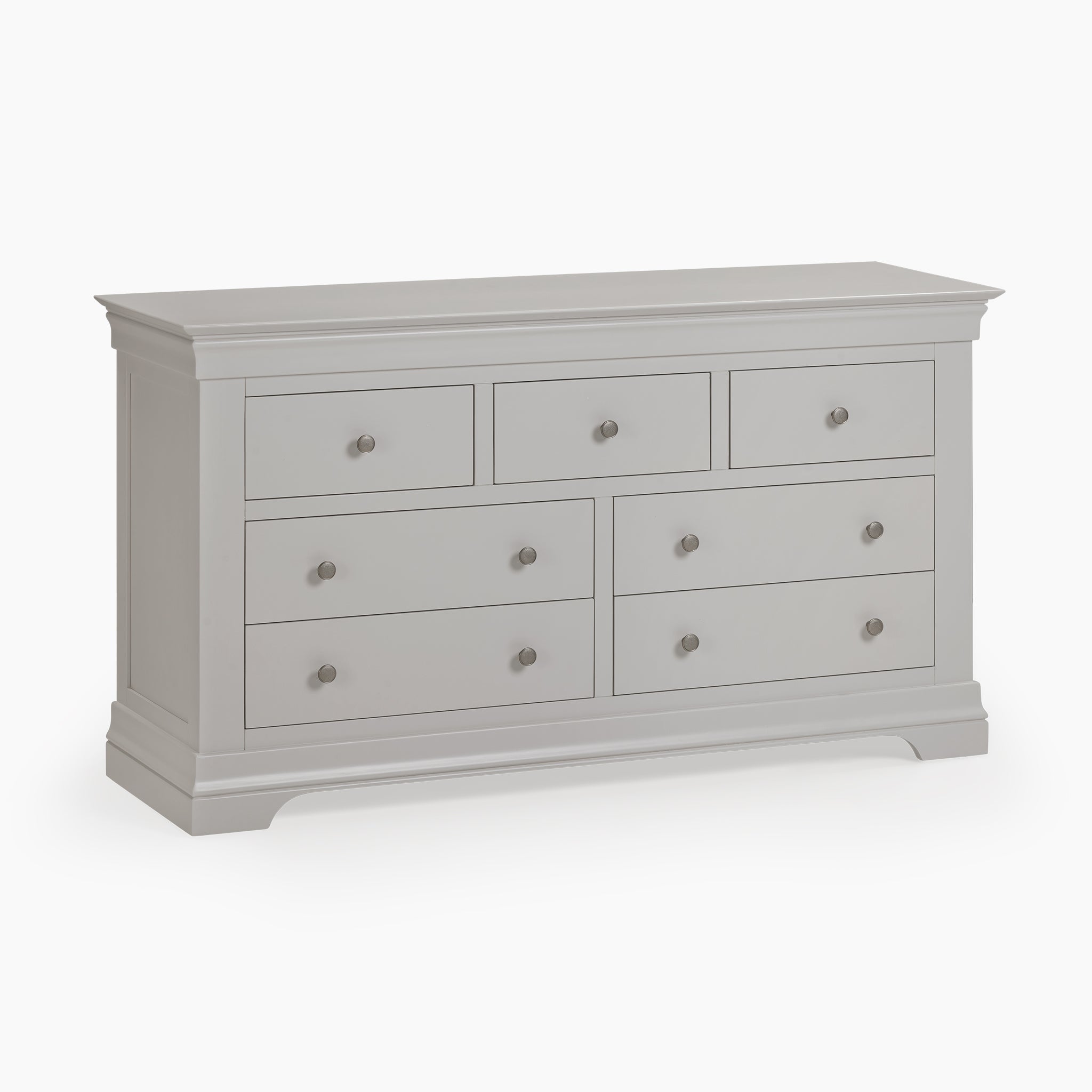 The Chalbury 3 Over 4 Chest of Drawers in Pebble Grey is a stunning piece of storage furniture. It boasts six spacious drawers with round knobs and a classic design, resting on a plinth base, that brings both elegance and functionality to your space.