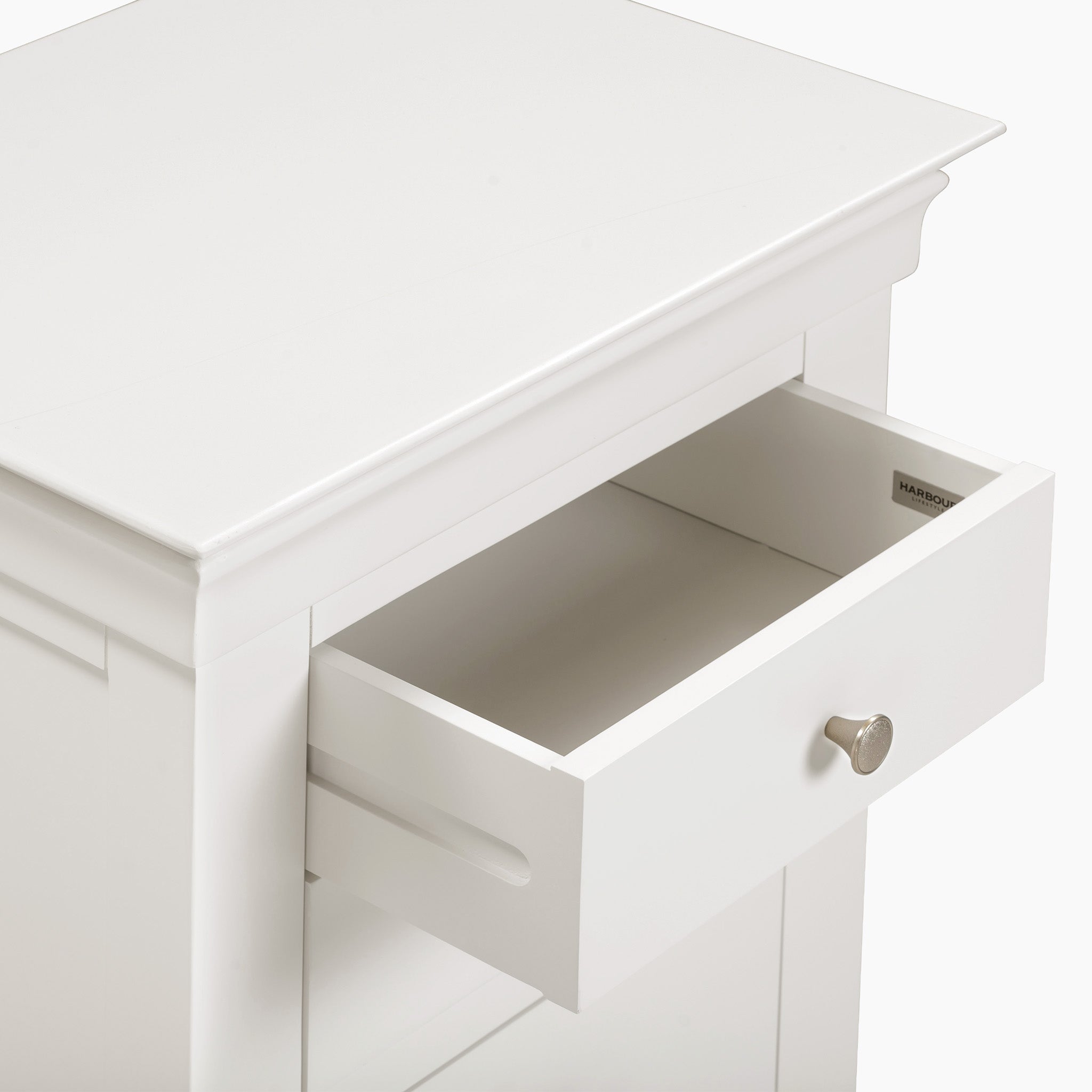 Pull open the round-knobbed drawer on the Chalbury 5 Chest of Drawers in Warm White, a sophisticated storage furniture piece.