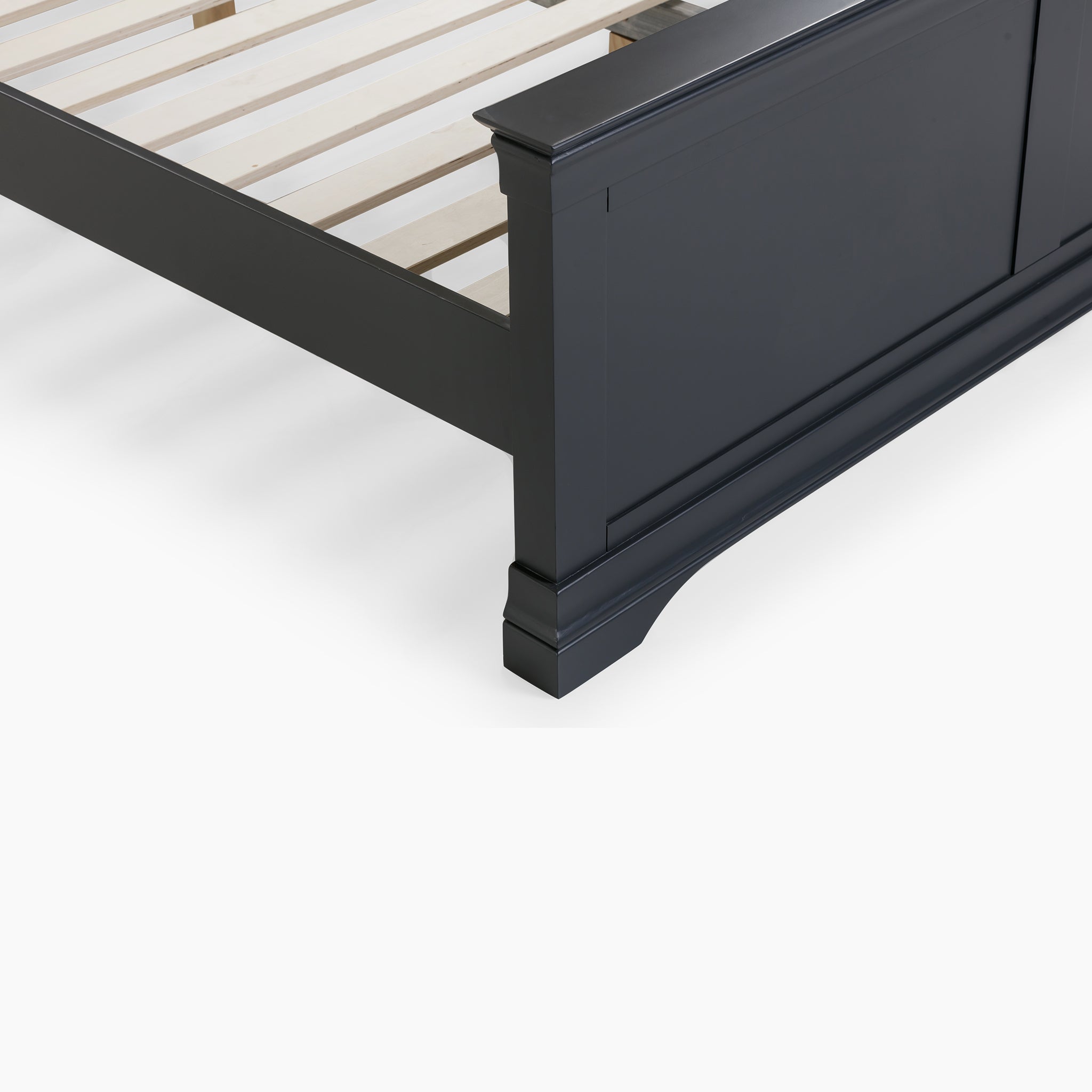 Close-up of the Chalbury 4ft 6" High End Double Bed Frame in Dusky Black, showcasing its solid oak structure with a slatted base, highlighting the intricate corner details and side rail for a luxurious sleeping experience.