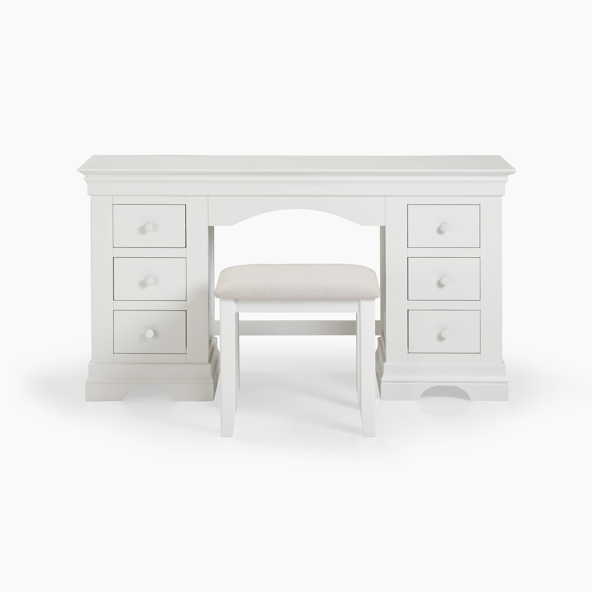 The Chalbury Dressing Table with Drawers in Warm White boasts six drawers and comes with an upholstered stool.