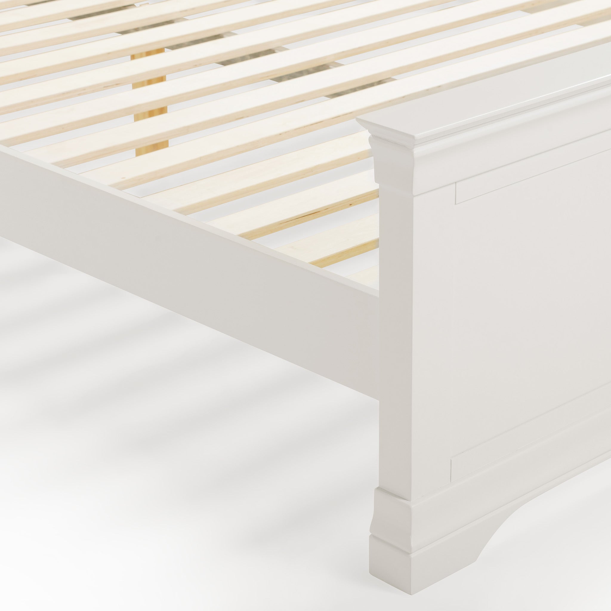 The Chalbury 5ft High-End Kingsize Bed Frame in Warm White showcases a sleek white wooden design with a slatted base, creating a striking contrast against a plain background.