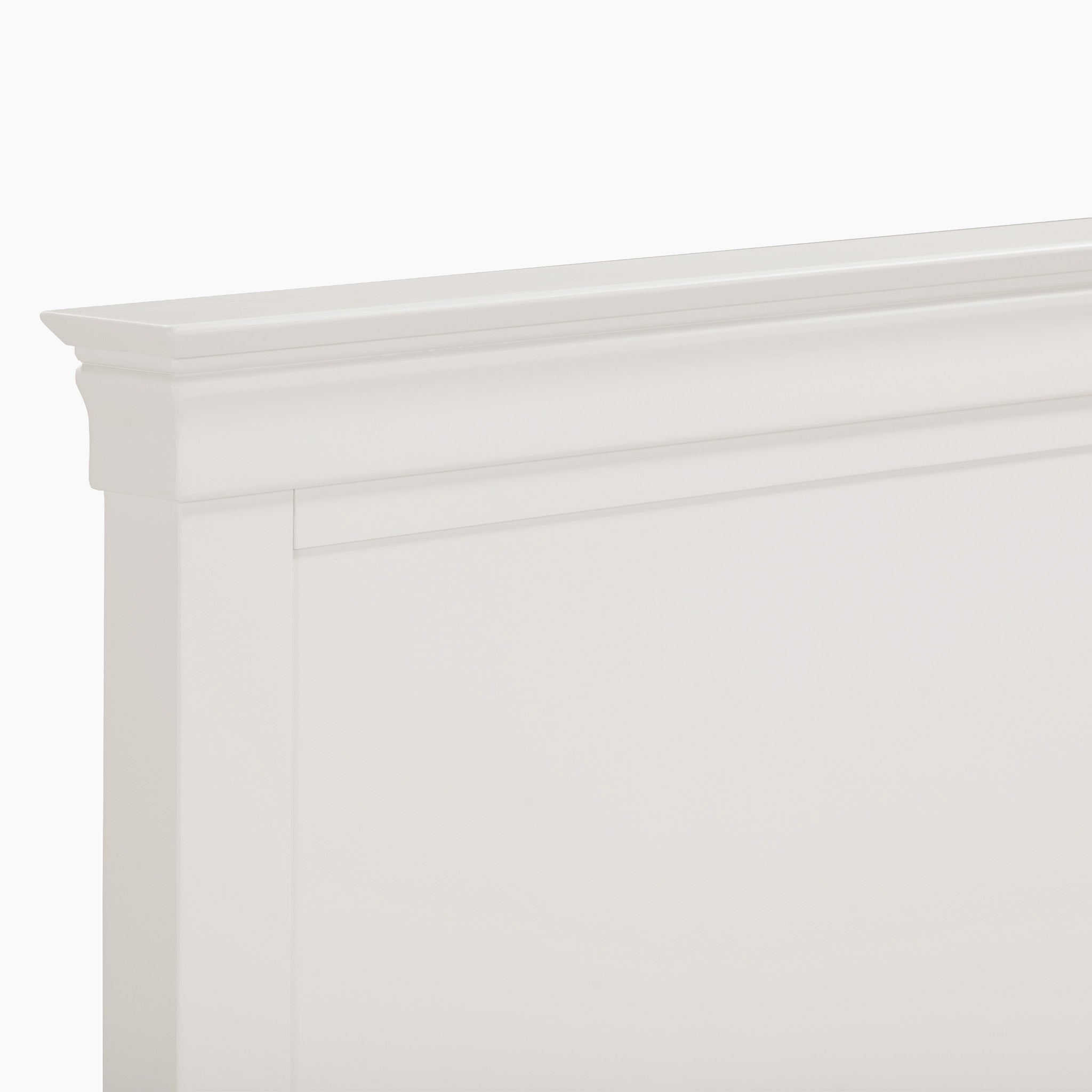 The Chalbury 5ft High-End Kingsize Bed Frame in Warm White boasts a beautifully crafted headboard, highlighted by clean lines and decorative molding along the top edge.