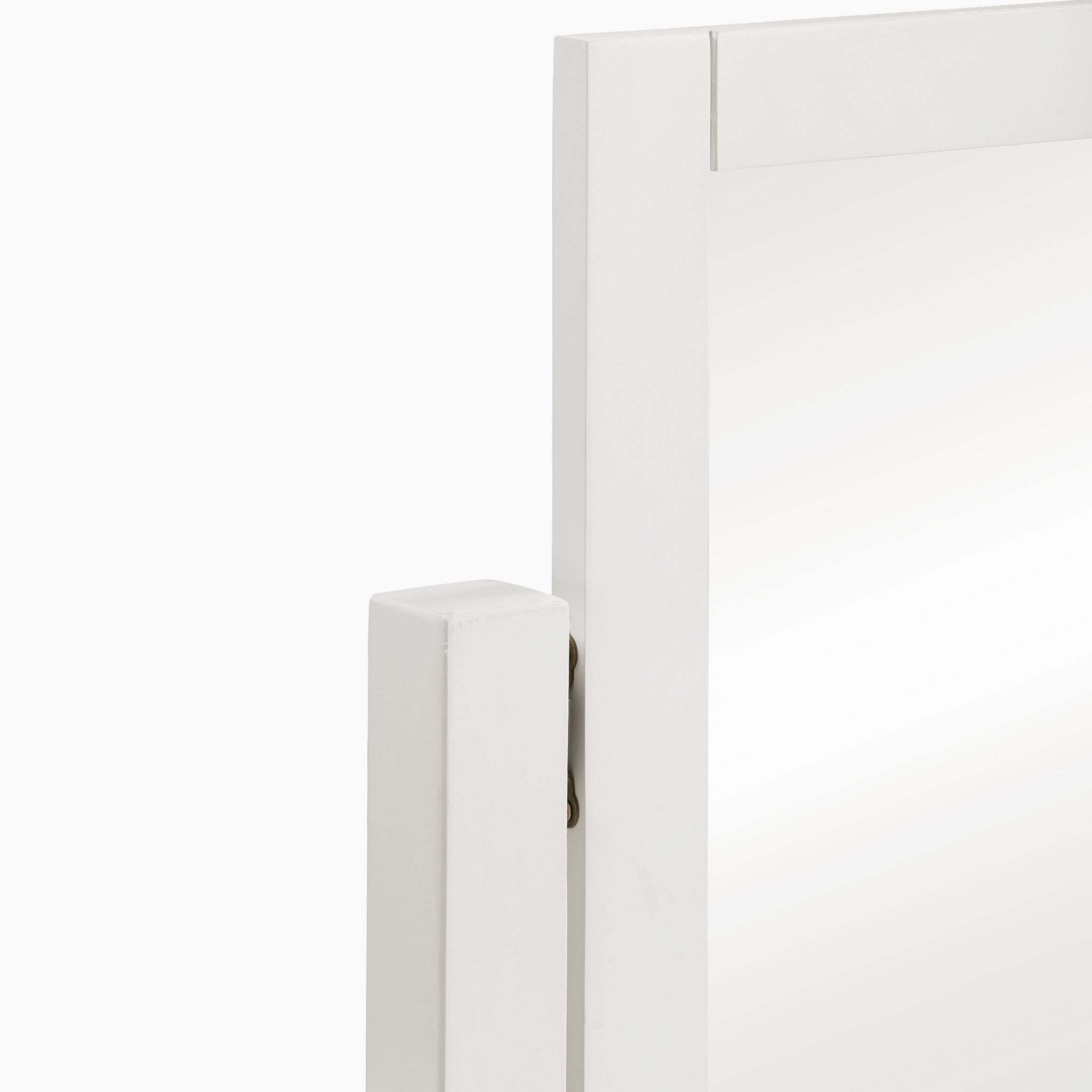 This close-up highlights the Chalbury Mirror in Warm White, boasting a contemporary design with intricate corner details. The inviting warm white finish seamlessly merges style and sophistication into any space.