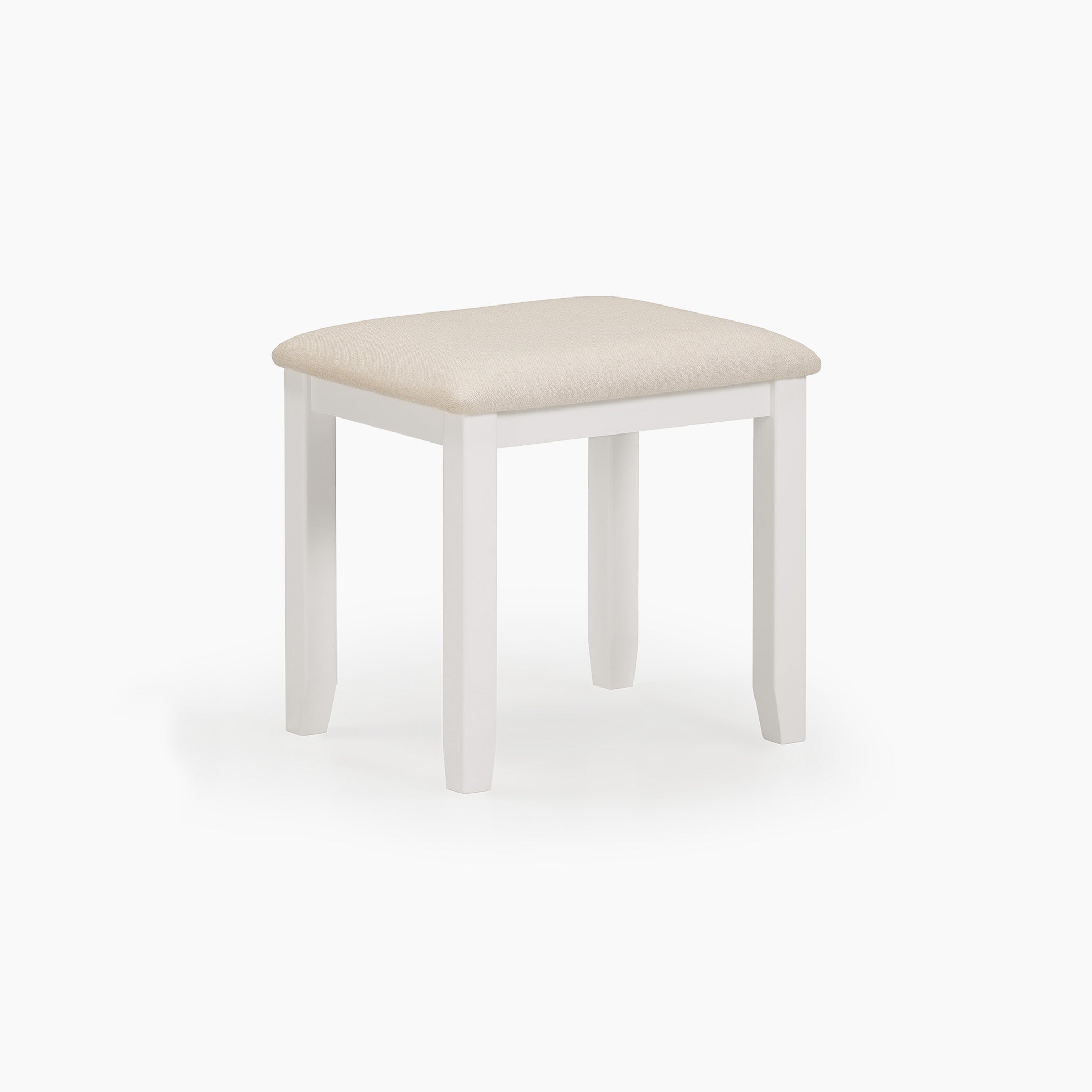 The Chalbury Stool in Warm White boasts a wooden frame finished in a warm white hue, paired with an integrated beige cushioned seat, beautifully showcased against a simple background.