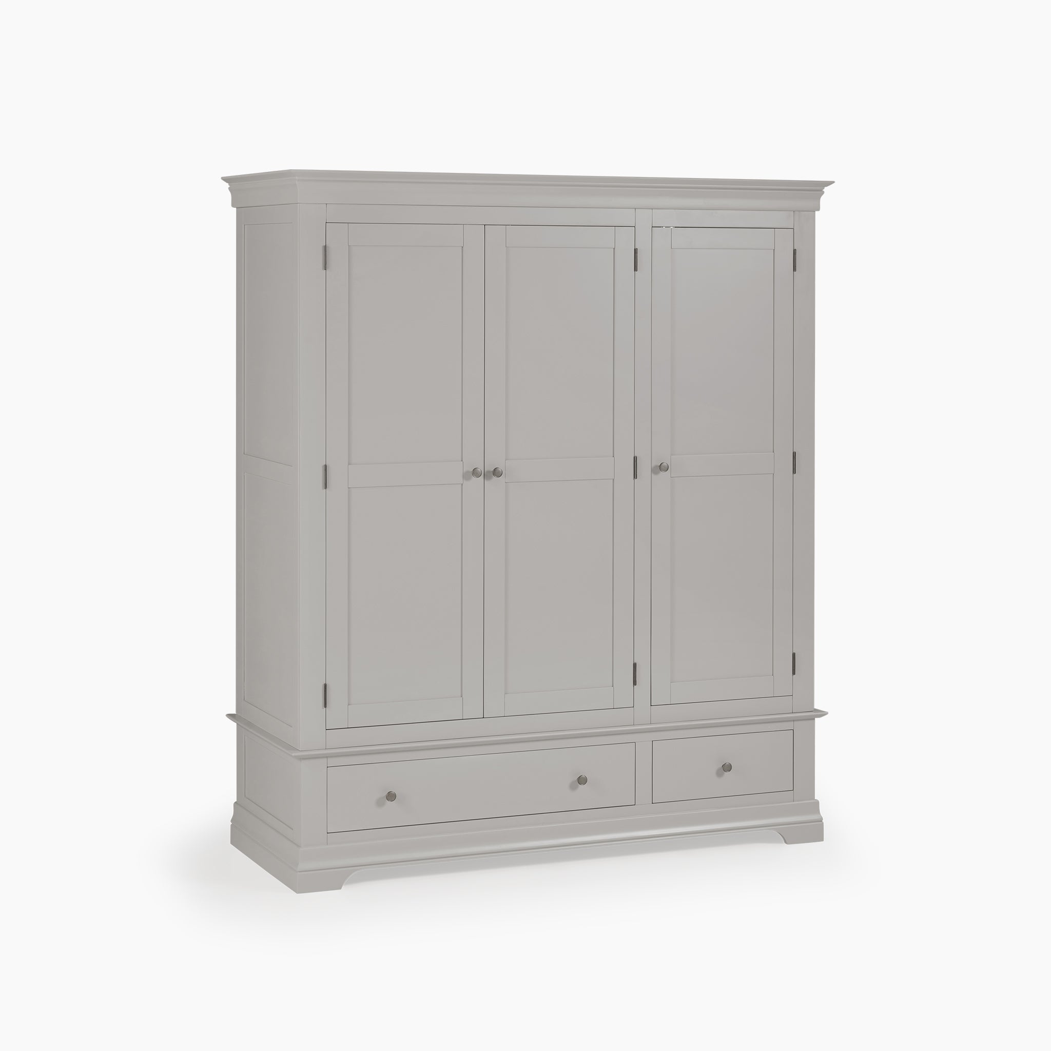 The Chalbury Triple Wardrobe in Pebble Grey is made from solid oak and offers a sophisticated design with three doors and two spacious bottom drawers on a pristine white backdrop.