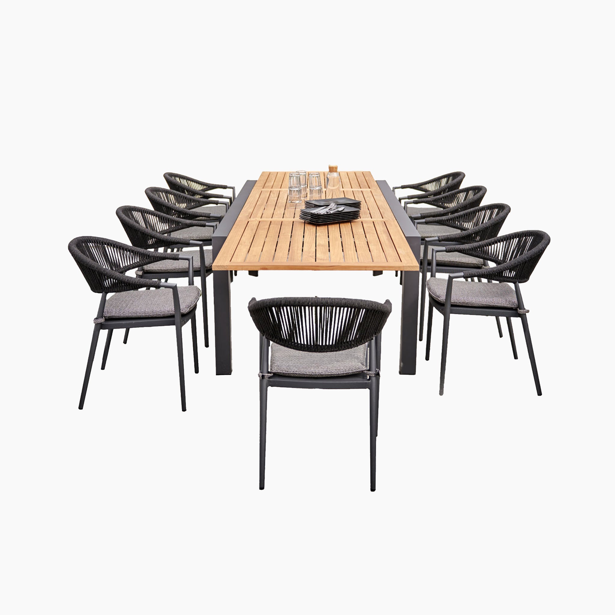 The Cloverly 8 Seat Rectangular Extending Dining Set with Teak Table in Charcoal includes a teak extending table and eight gray cushioned, woven chairs, all set against a white background.