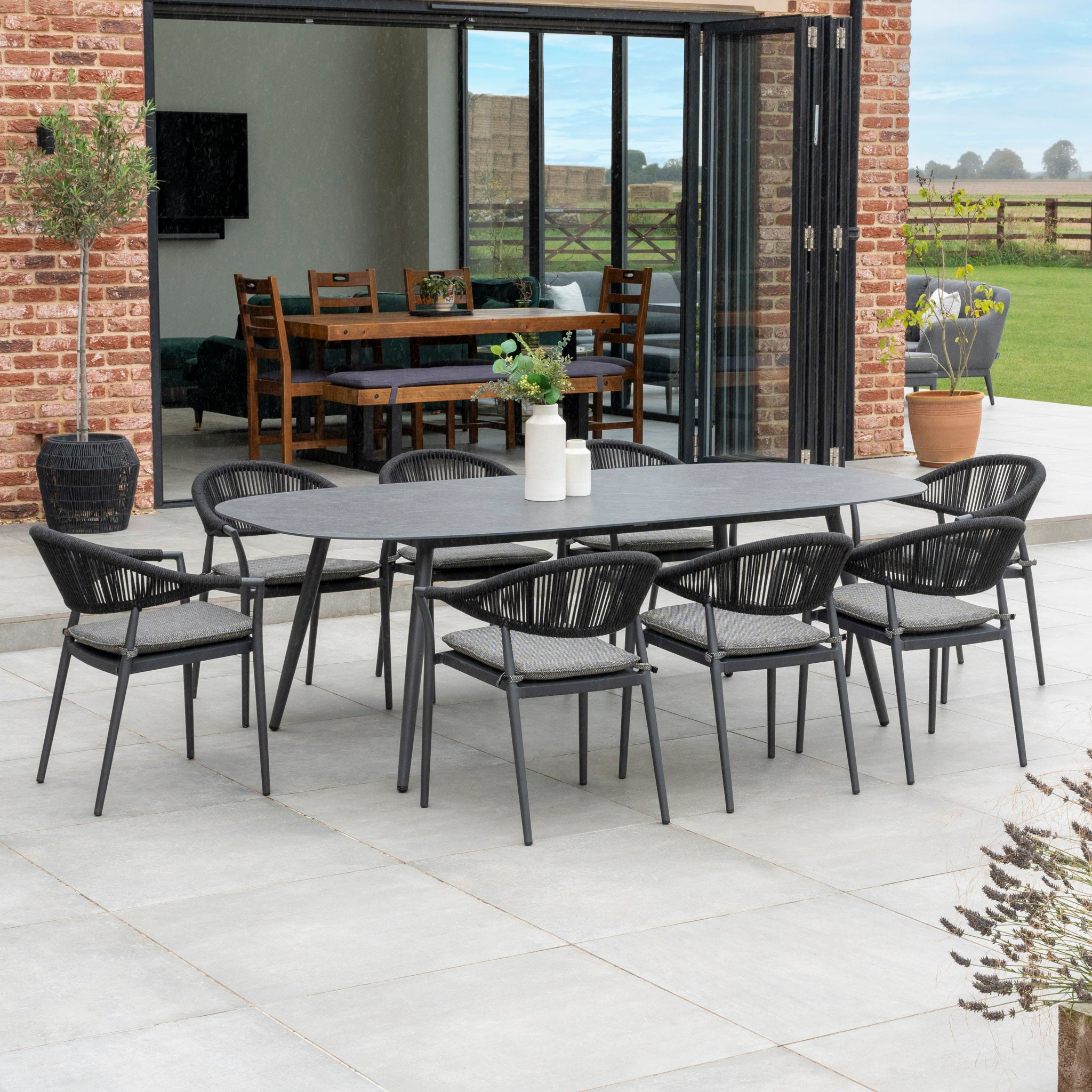 Cloverly 8 Seat Rope Oval Dining Set with Ceramic Table in Charcoal