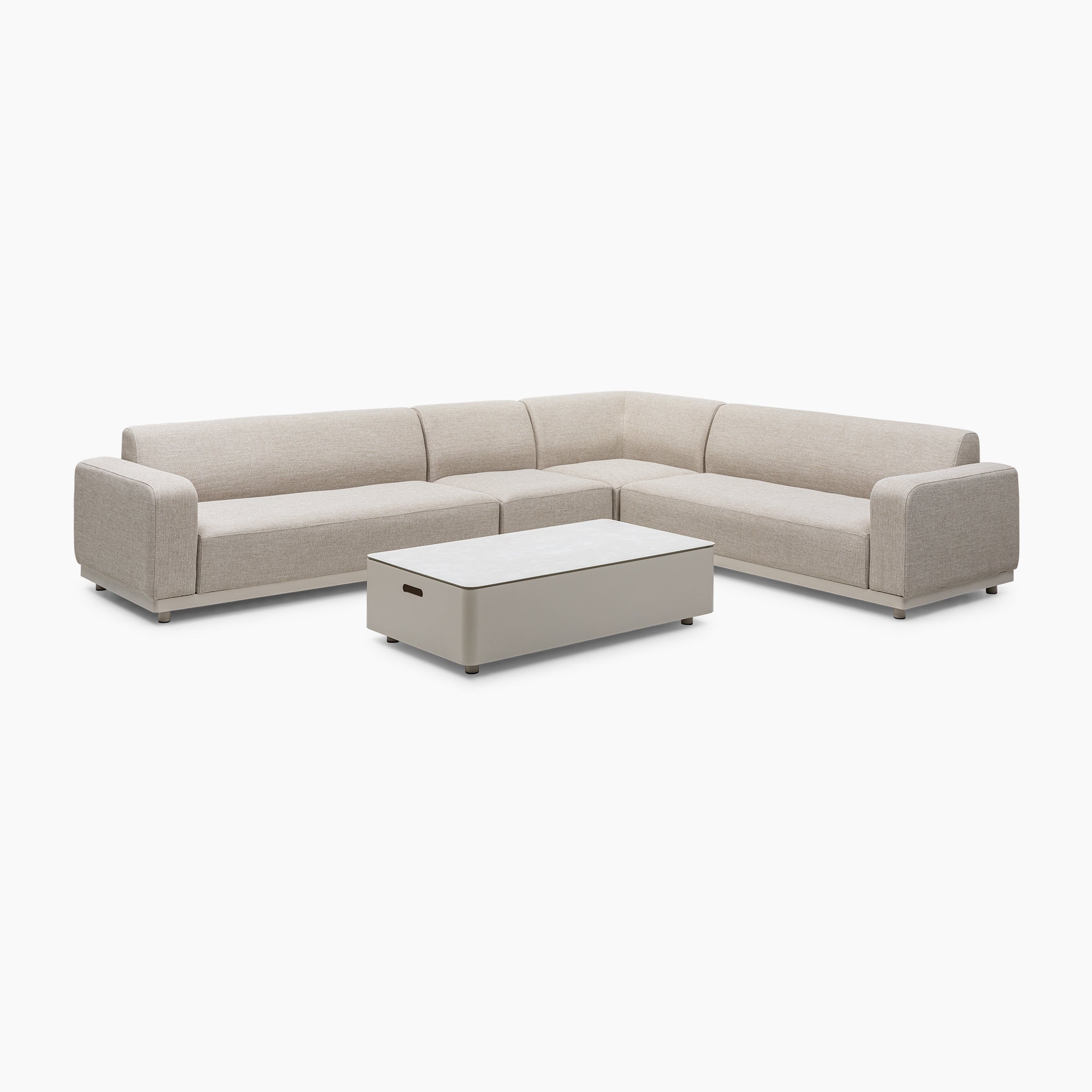 The Luna Outdoor Fabric Large Corner Group Set in Fawn, featuring an L-shaped sectional and a low rectangular coffee table, provides all-weather, maintenance-free elegance on a white background.