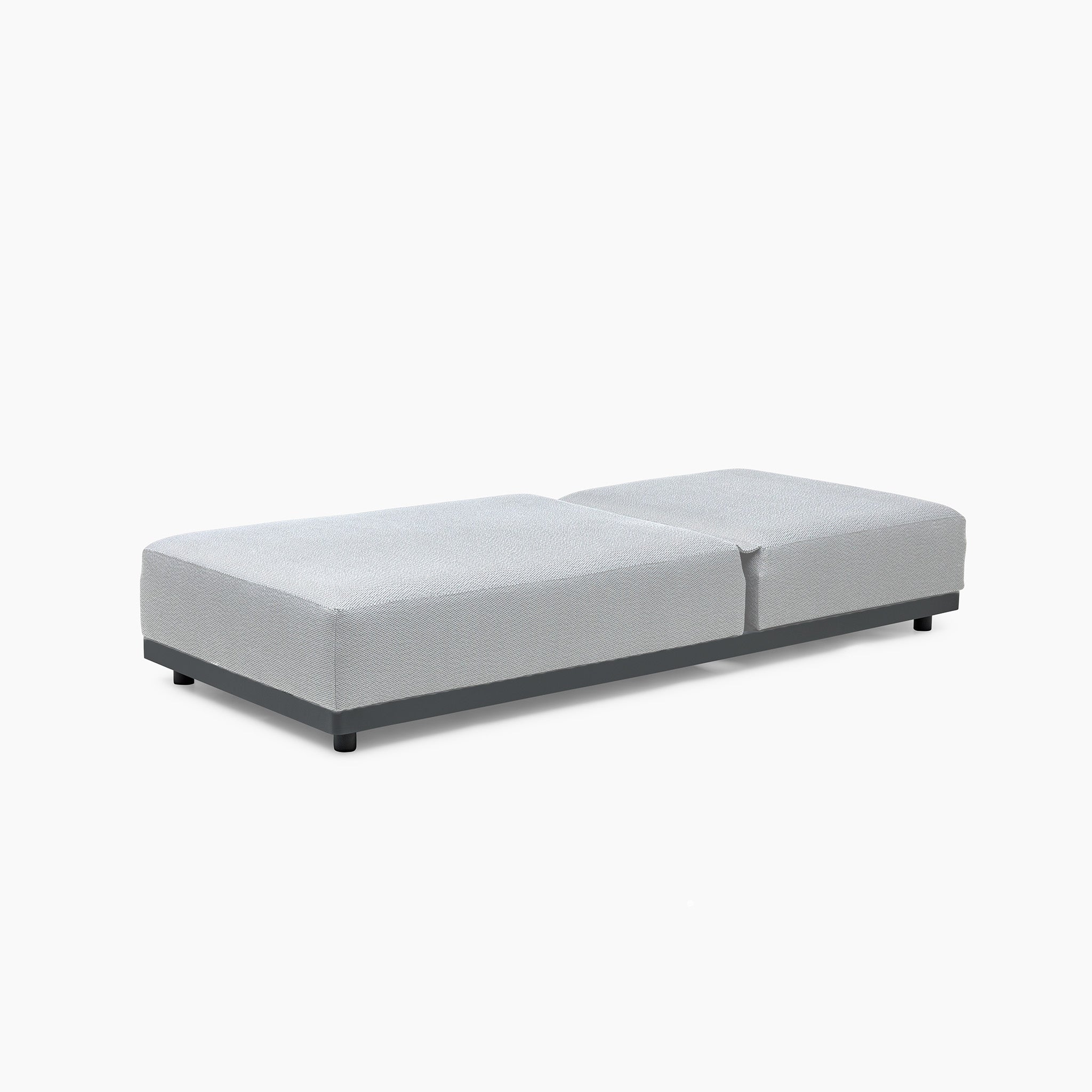 A minimalist light gray platform bed with a low profile and black legs is set against a white background, echoing the sleek design of the Luna Outdoor Fabric Deluxe Sun Lounger with Bolster Cushion in Oyster Grey.