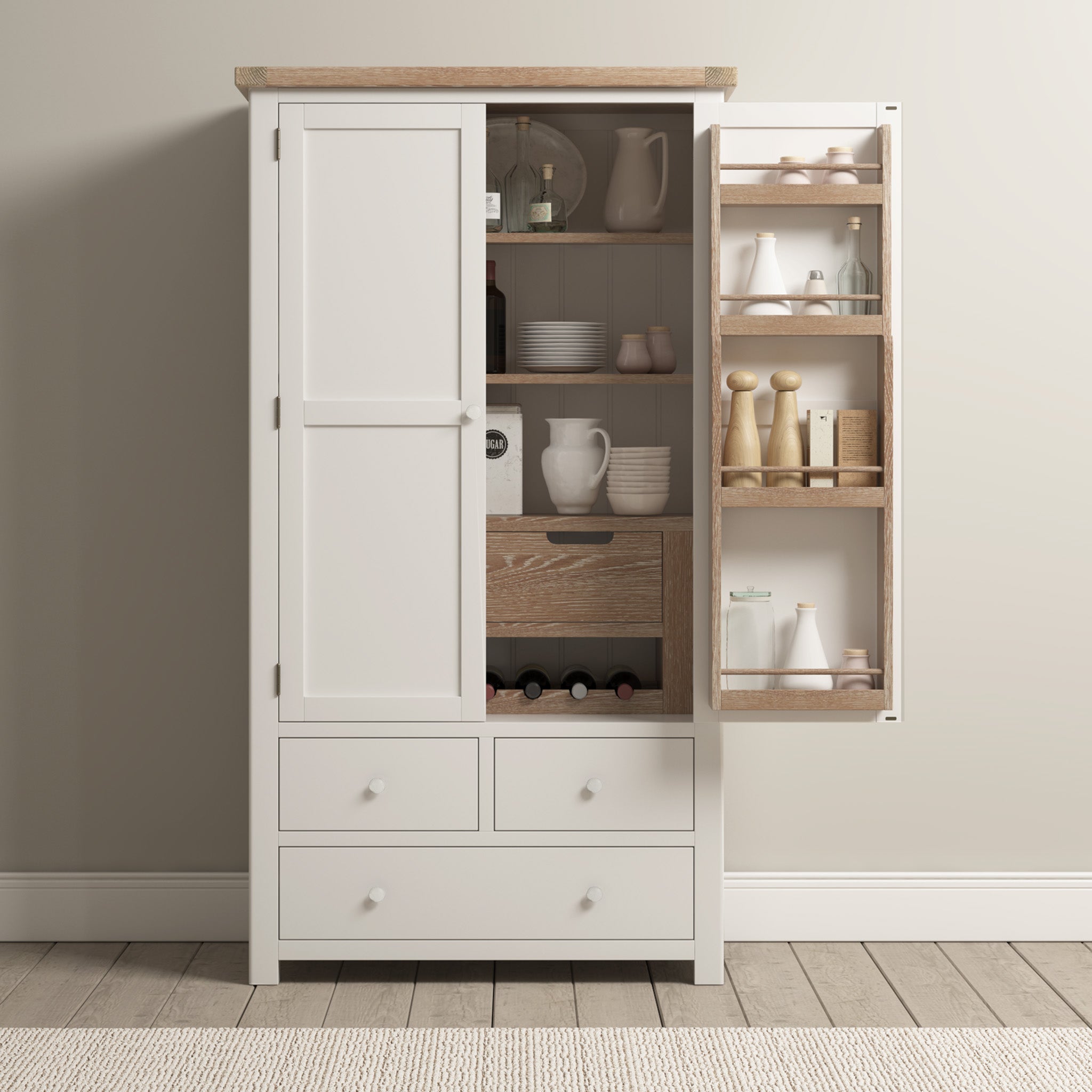 The Burford Double Larder Unit in Warm White, with its open doors, displays an array of crockery, jars, and wine bottles against a light wall. Its natural oak accents provide stylish storage and organization for any kitchen space.