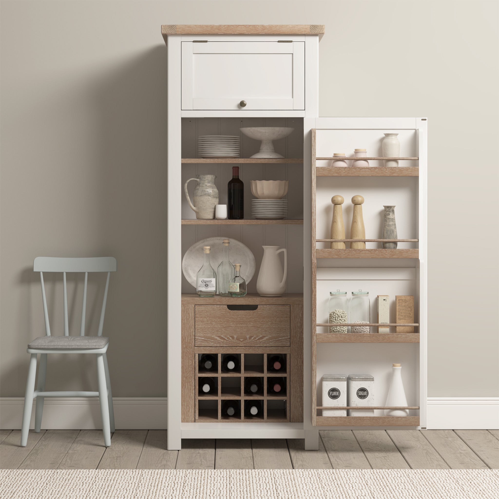 The Burford Single Larder Unit in Warm White provides an organized space for dishes, bottles, and spice jars with its elegantly designed kitchen cabinet. A blue chair sits gracefully next to it on a hardwood floor, highlighting the perfect combination of style and practical kitchen storage.