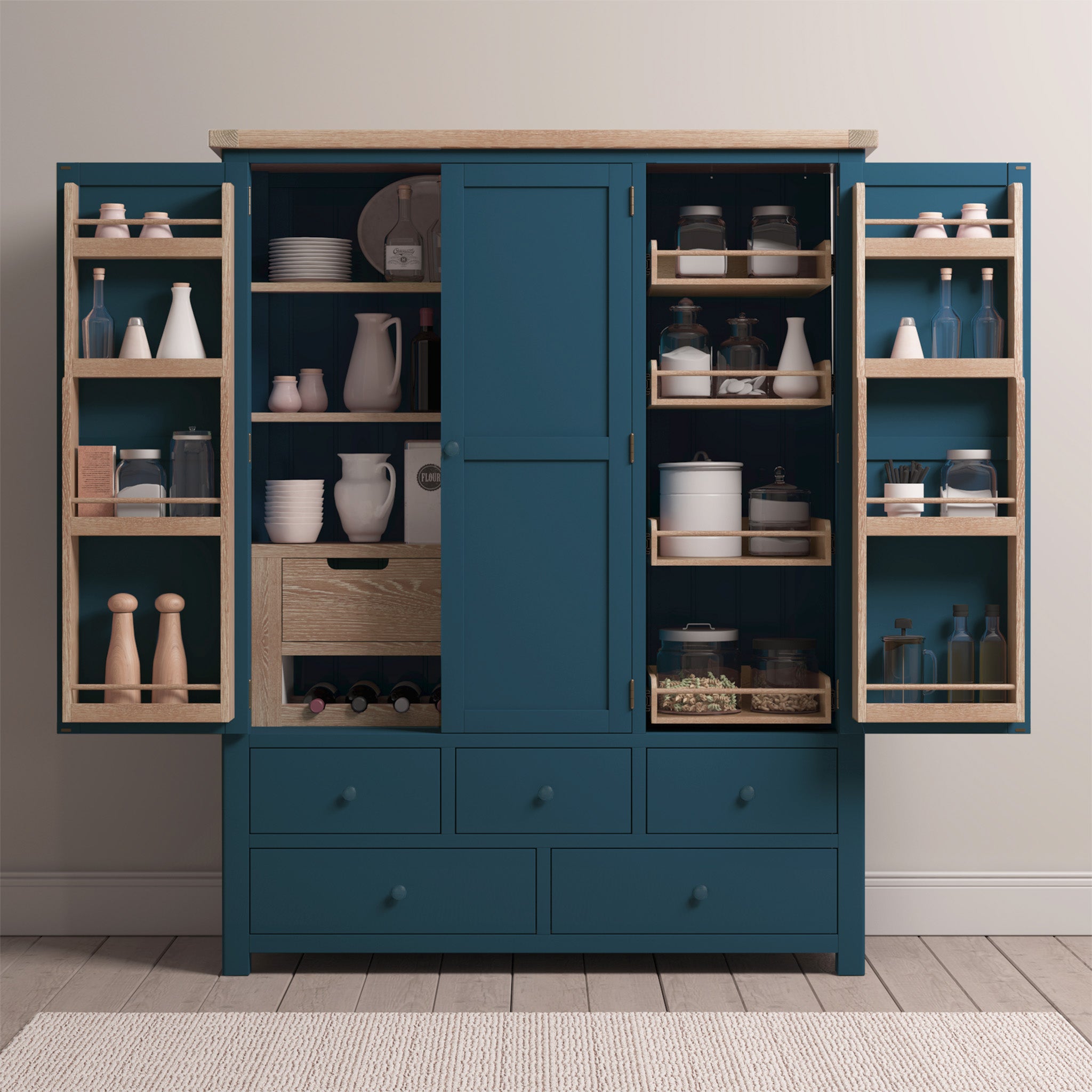 The Burford Triple Larder Unit in Navy Blue includes a solid oak top and open doors that reveal shelves stocked with jars, dishes, and other kitchen essentials.