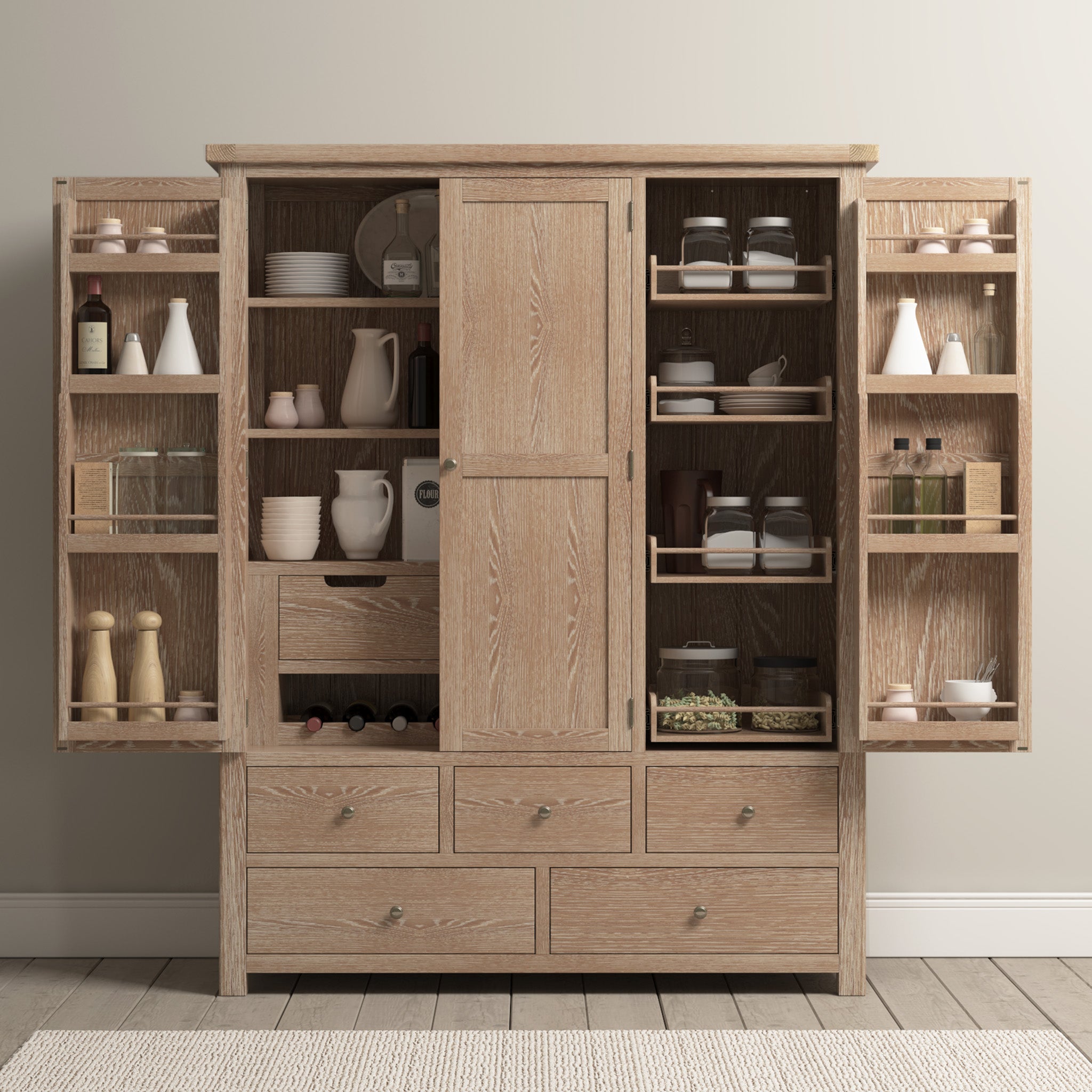 The Burford Triple Larder Unit in Natural Oak features open doors that reveal shelves filled with dishes, jars, bottles, and spices against a light-colored wall. Designed as a versatile kitchen storage solution, it brings both functionality and style to your culinary space.