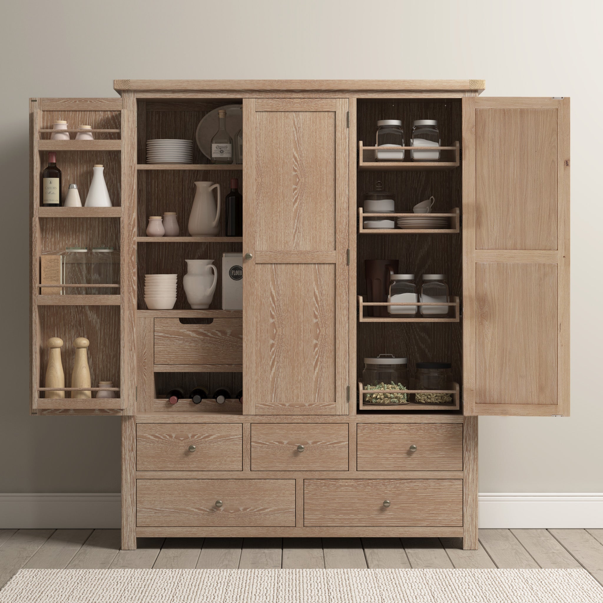 The Burford Triple Larder Unit in Natural Oak features open doors revealing dishes, jars, spices, and wine bottles on a beige carpet. This chic piece offers stylish and efficient kitchen storage for all your essentials.