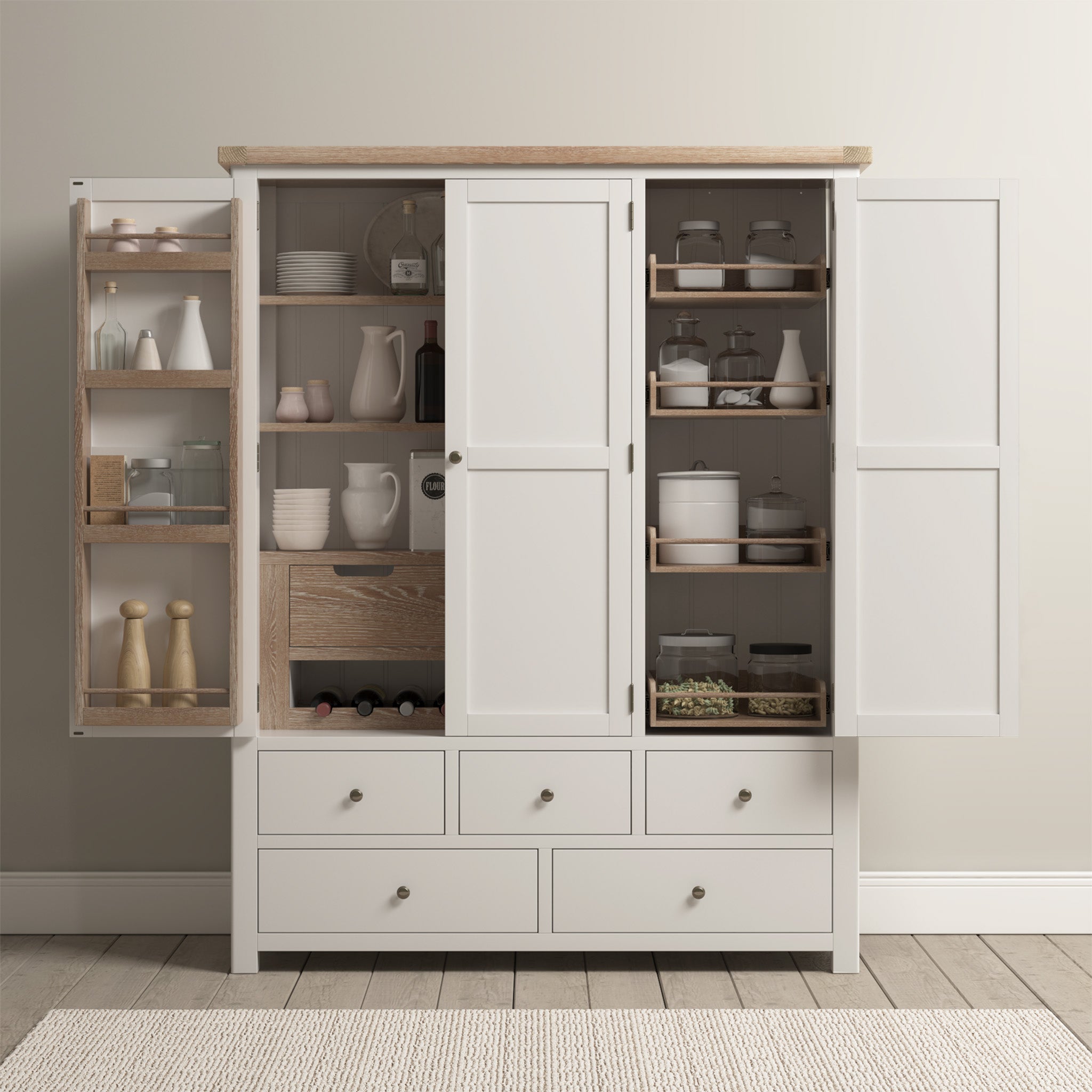 The Burford Triple Larder Unit in Warm White showcases a pantry with open doors, revealing versatile storage options like shelves with jars, utensils, and containers, along with six large drawers below.