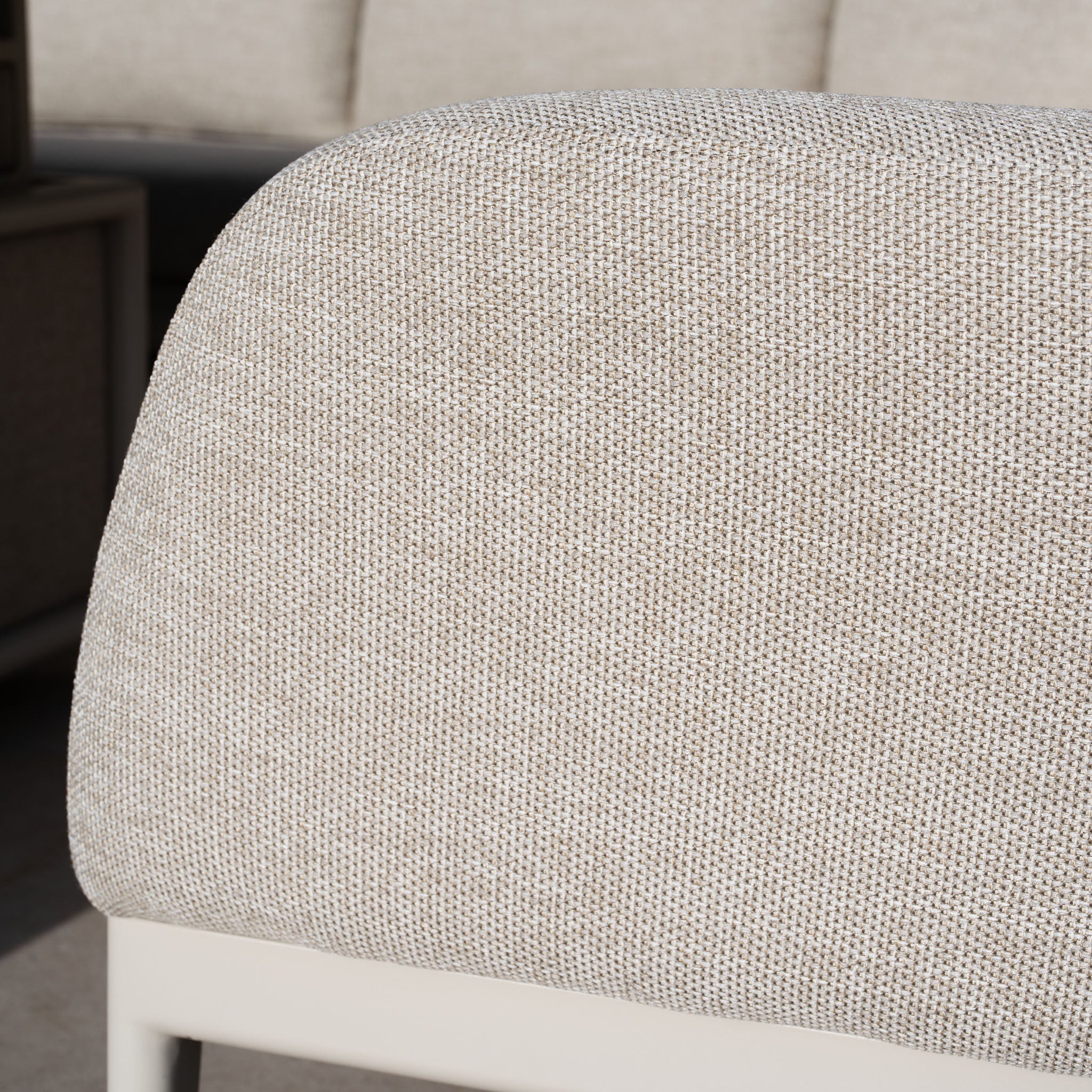 Close-up of the textured fabric in Fawn from the Luna U-Shape Outdoor Fabric Corner Dining set's backrest, featuring a neutral color palette.