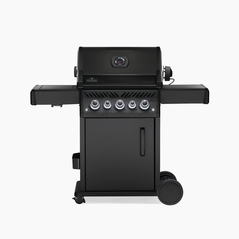 The Napoleon Phantom Rogue® SE 425 RSIB Gas Barbecue features four control knobs, side shelves, infrared burners, and wheels on the bottom for mobility.