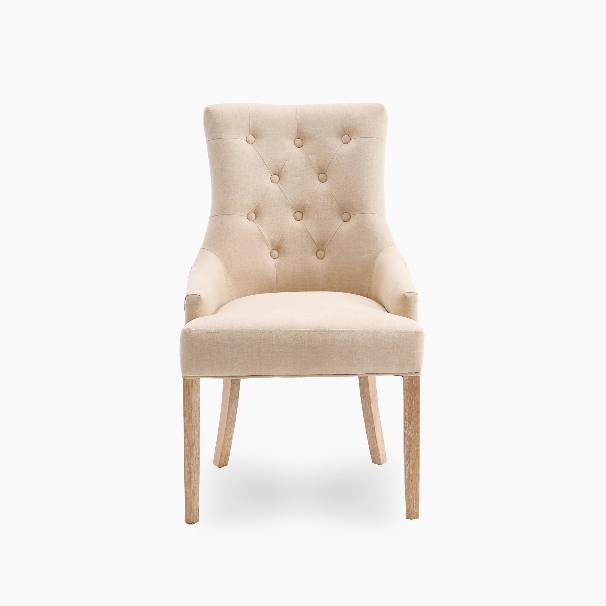 A set of two Regent chairs in beige tufted upholstery, featuring elegant wooden legs, is displayed against a pristine white background.