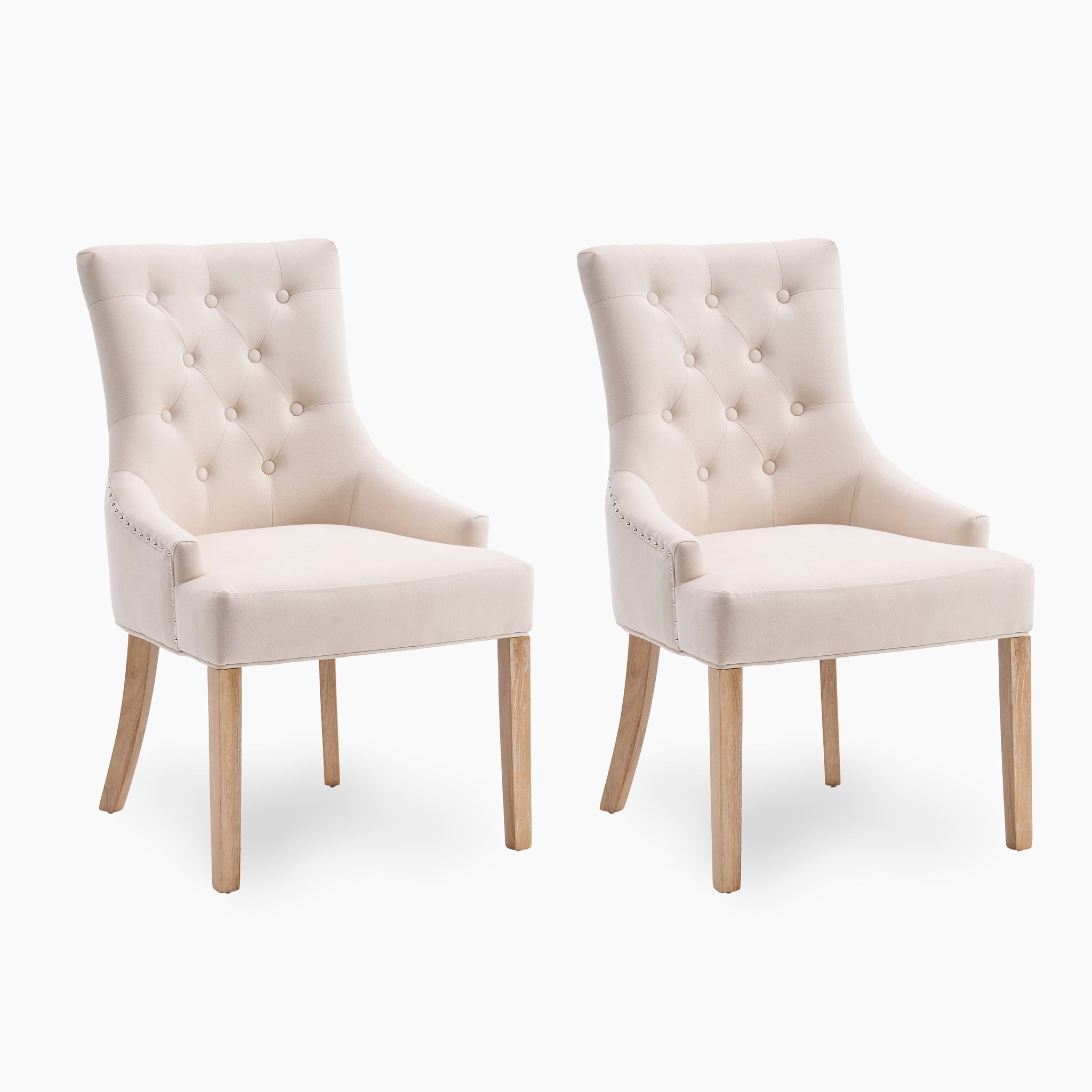 The Regent Chair Set of 2 in Ivory, featuring button-tufted backs and wooden legs, stands elegantly against a white background.