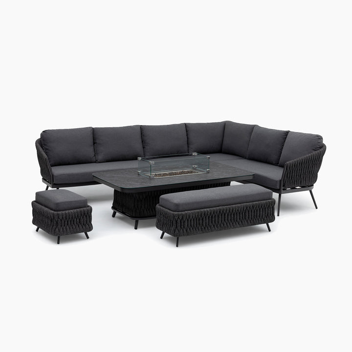 Palma Rope Rectangular Corner Dining Set with Rising Firepit Table in Grey (Right Hand), featuring a modern dark gray sectional design with ottomans and a coffee table, adorned with glass details and aluminium frames combined with water-repelling thick rope weave, on a white background.