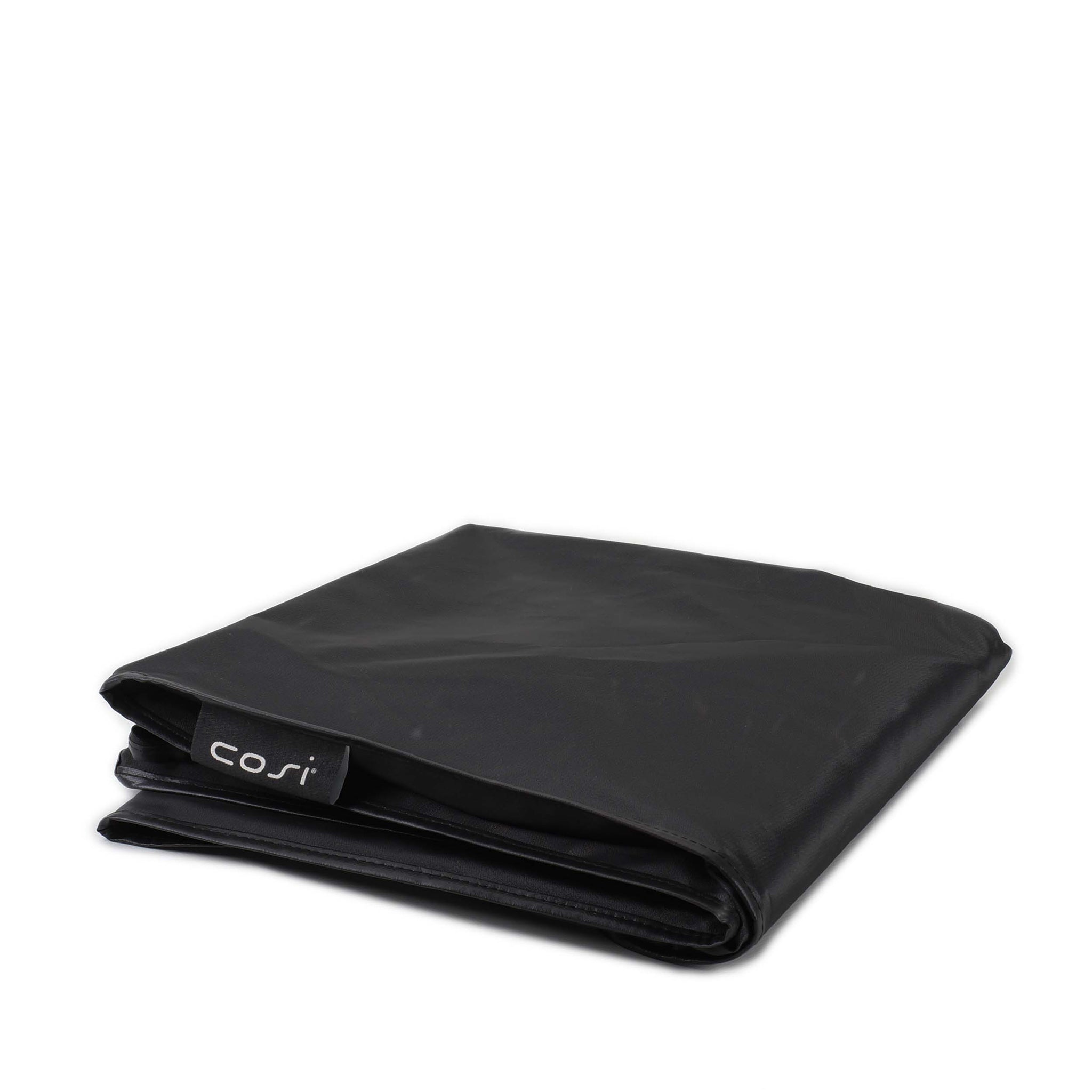 A folded black cover with a small "Cosi" tag on a white background offers UV protection, like the Cosi - Cosicube 70 All Weather Protection Cover.