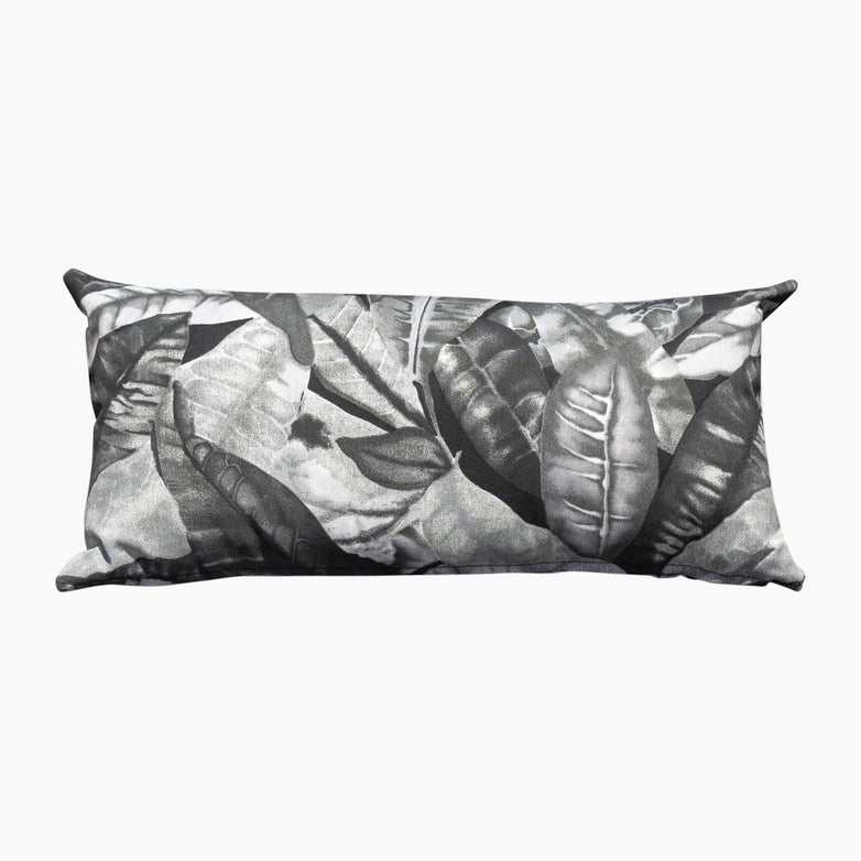 Acrisole Amazonia Gris Bolster Scatter Cushion (60cm x 30cm) features a rectangular shape with a striking black and white tropical leaf pattern on solution-dyed acrylic fabric.