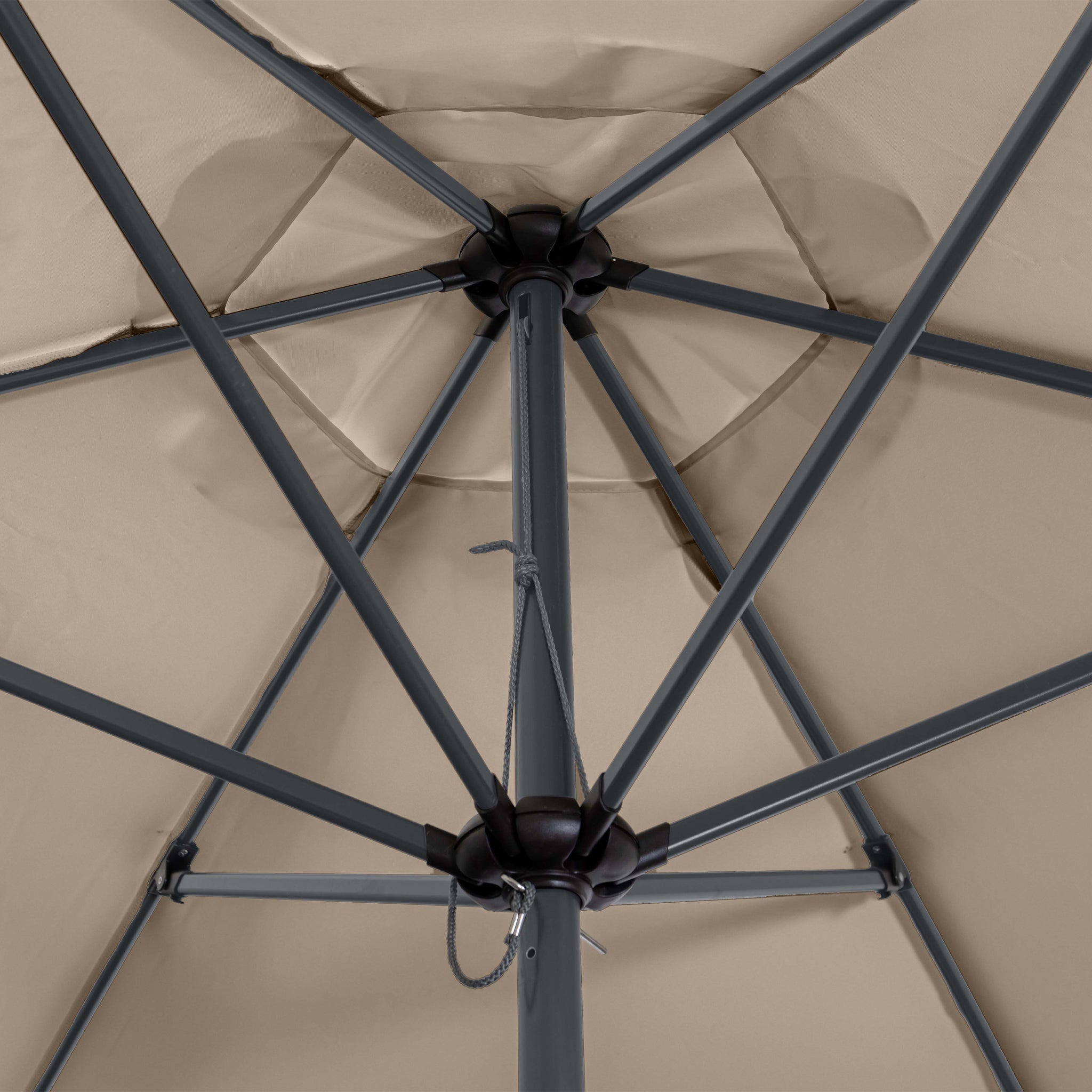 Close-up view of the underside of a Triton 3m Round Aluminium Parasol in Khaki, showcasing its supporting ribs and central pole. This patio umbrella offers UV protection and is fade resistant, promising durability and style for your outdoor space.