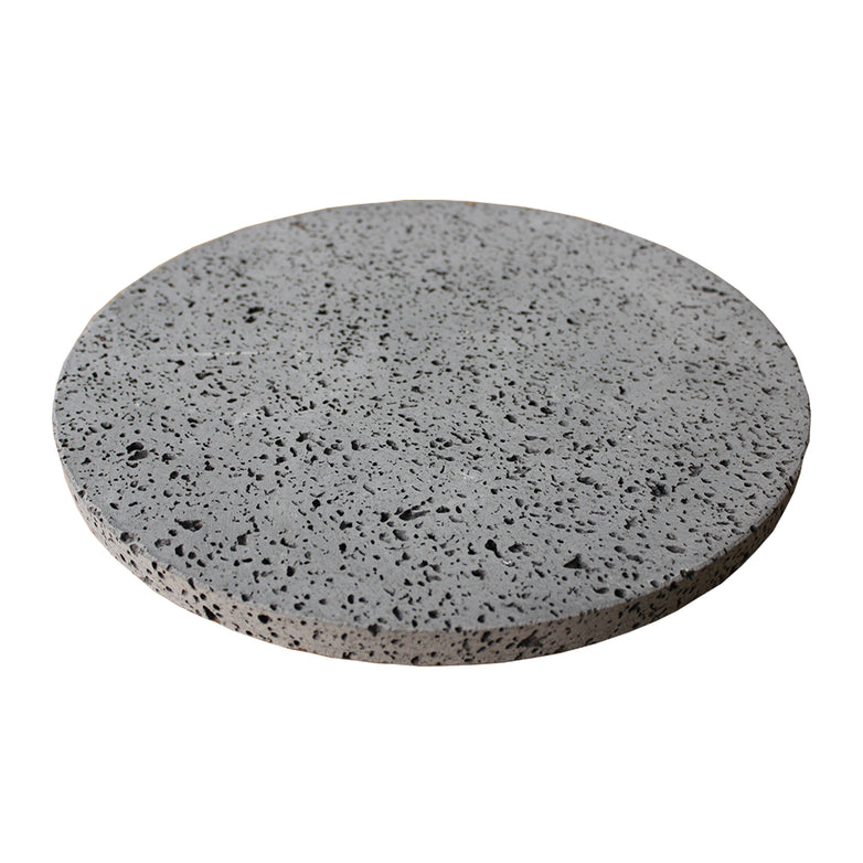 The Kamado Lava Pizza Stone for 21" & 22" Grill is a round, flat, grey stone with a speckled pattern, perfect for pizza lovers seeking that authentic stone-baked pizza experience.