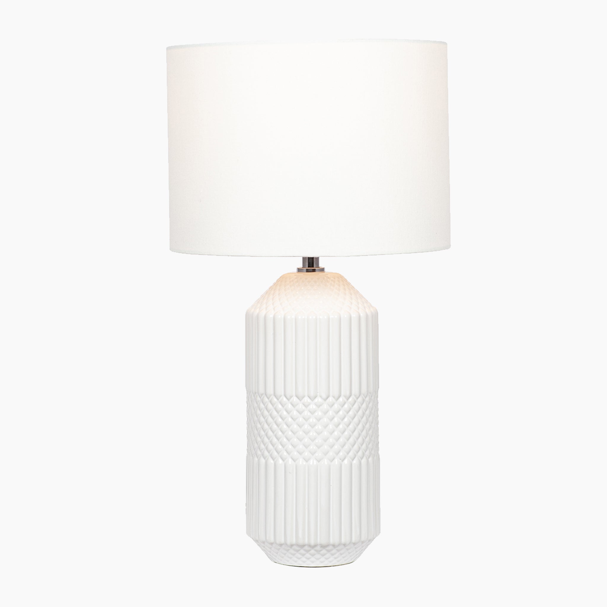 Meribel Geo Textured Tall Ceramic Table Lamp in White, featuring a textured tactile detail on the base and complemented by a cylindrical white faux cotton shade.